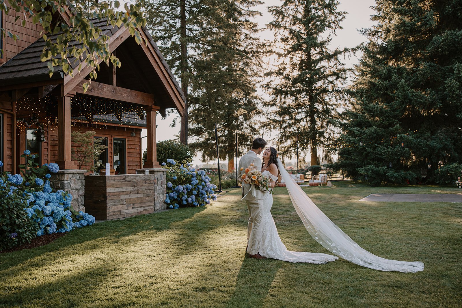 Bride and groom sharing candid moment at backyard wedding ceremony in the Columbia River Gorge.