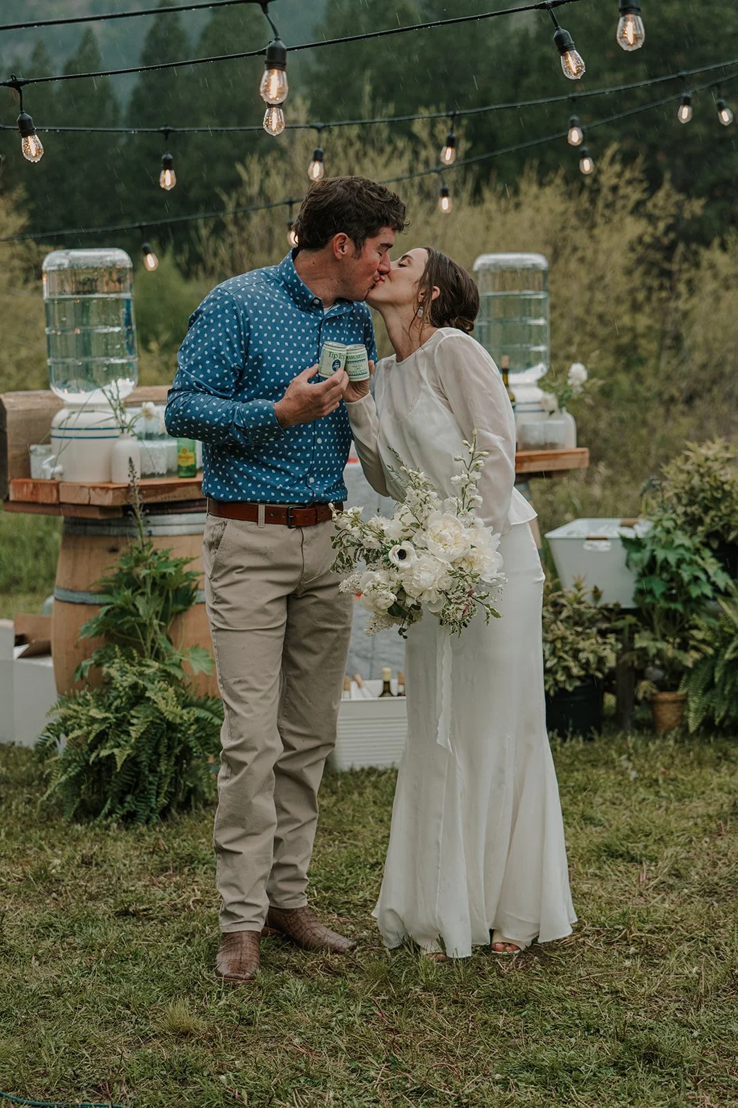 Bride and groom sharing a sweet moment during outdoor wedding reception at private venue in Missoula, MT.