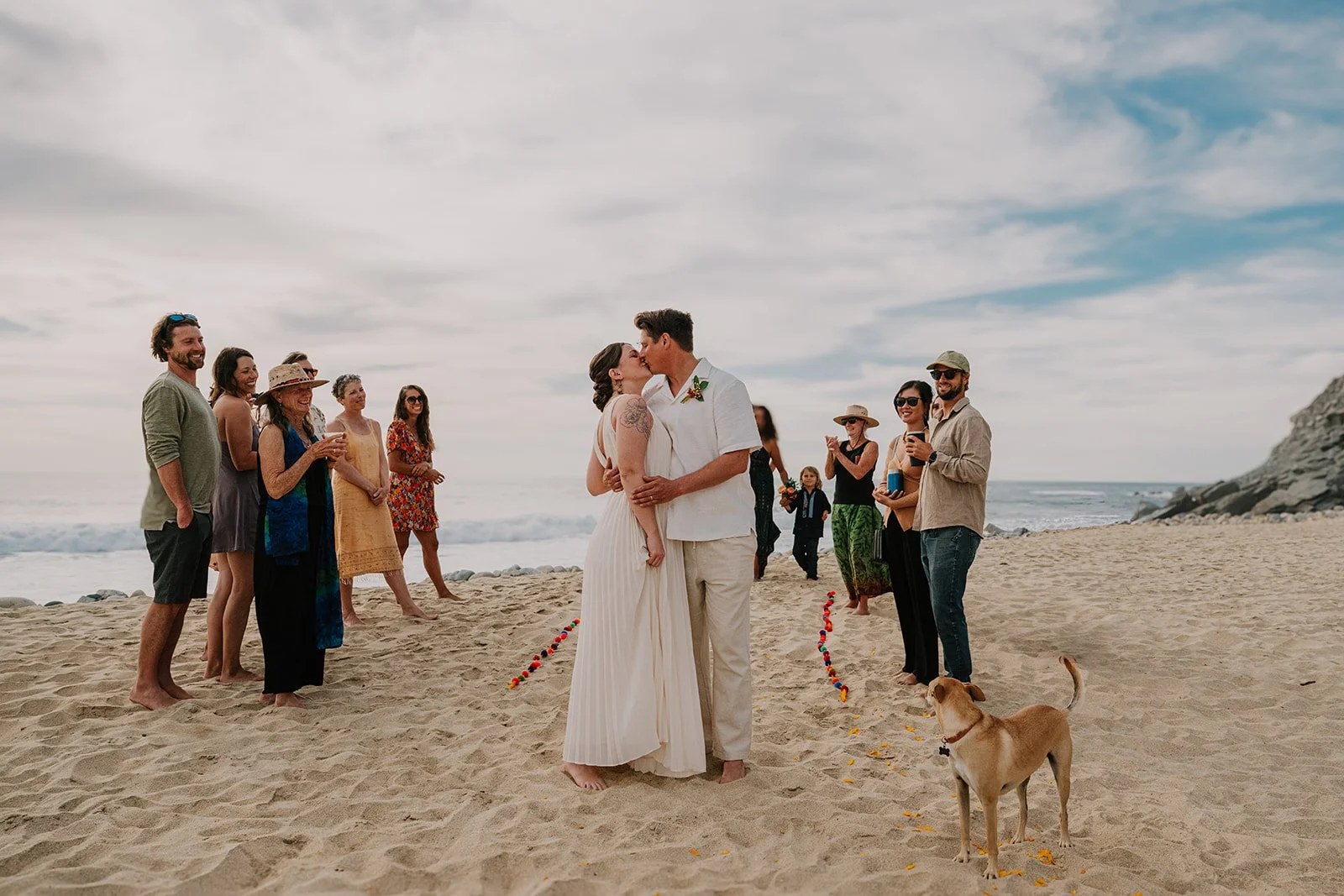 Bride and groom just married at private beach wedding ceremony in Todos Santos, Mexico shot by destination wedding photographer, Jen Jones.