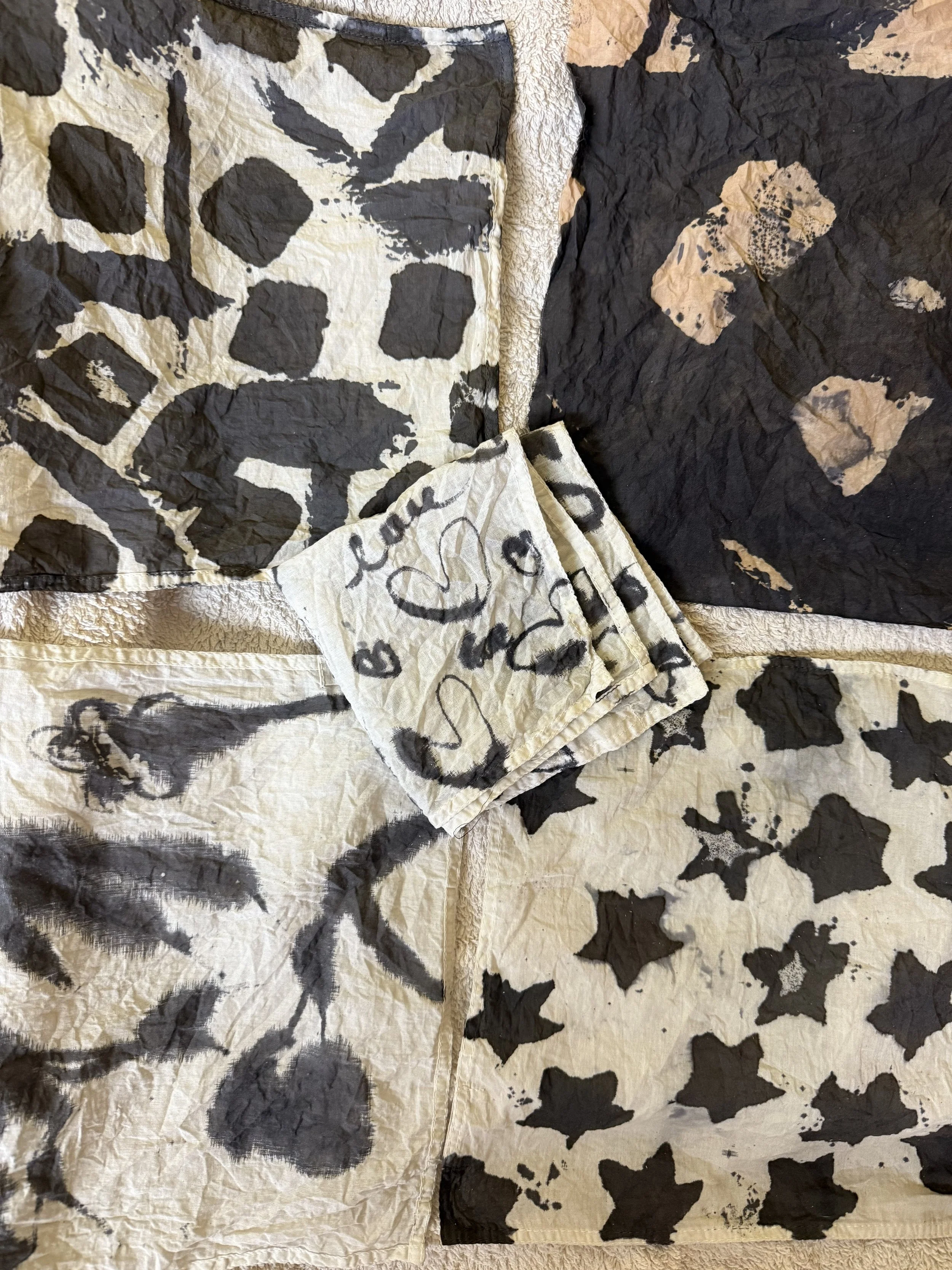 Natural dyeing of organic cotton using ferrous solution. Hand made stencils and brush work. 