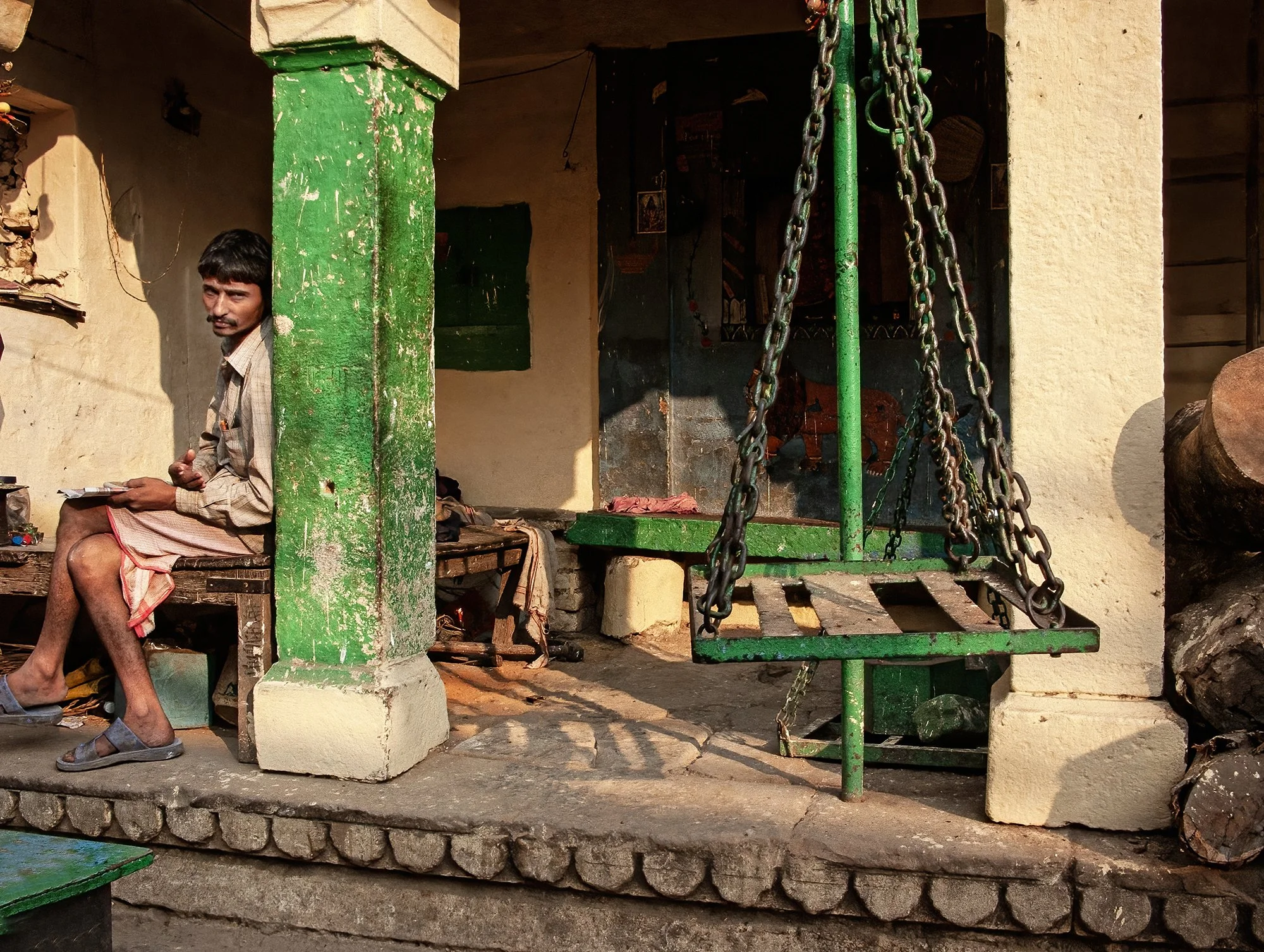 Saffron wood dealer, Manikarnika ghat. Varanasi.