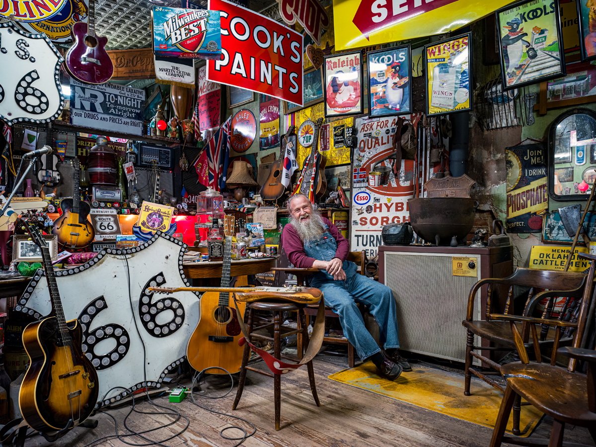 Harley Russell presiding and entertaining visitors at his Sandhill Curiosity Shop. Erick, Oklahoma. 2022.