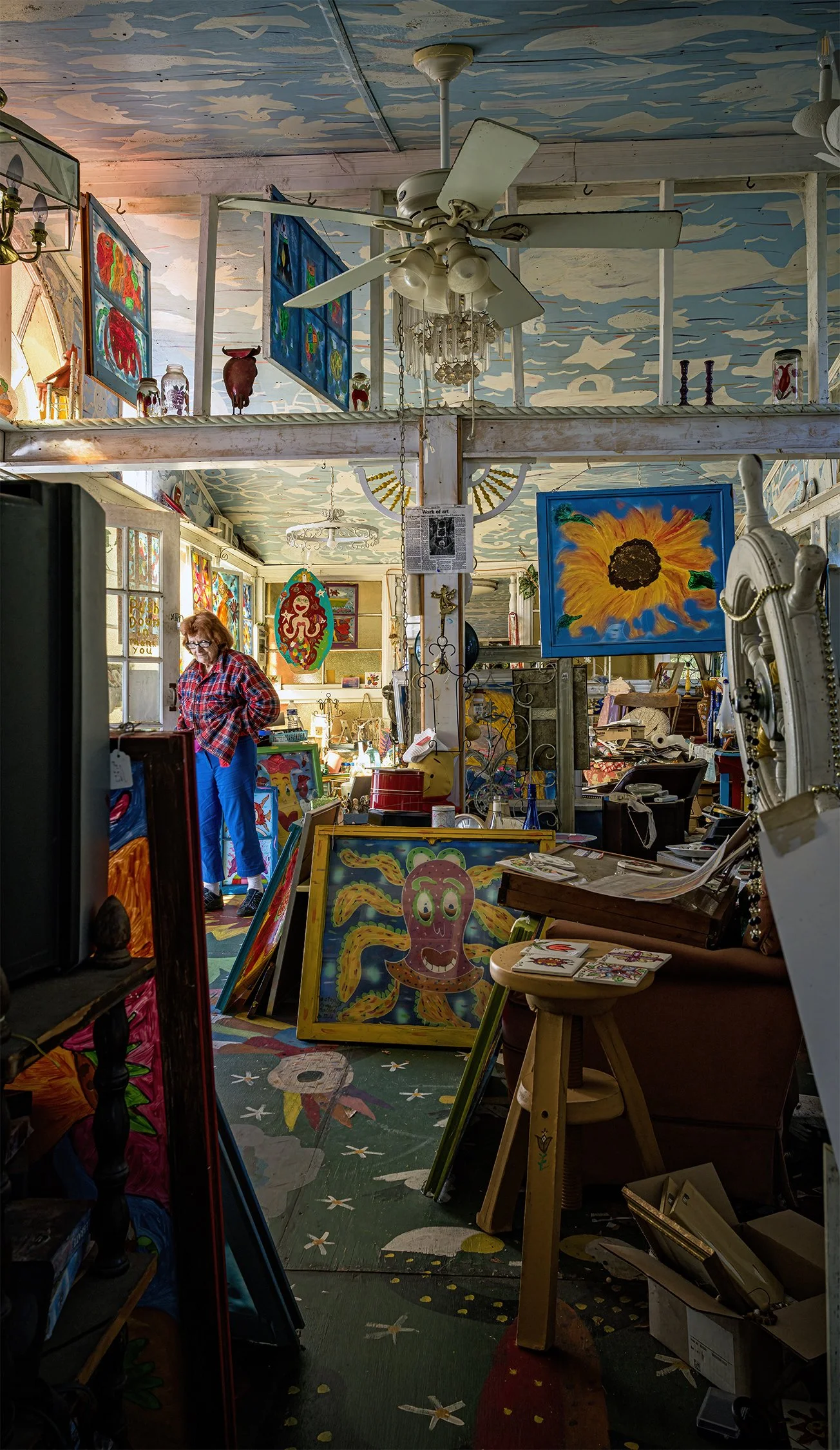 Mary Paulsen inside her “Visionary Folk Art Garden and Doll Baby Village.” Holden Beach, North Carolina. 2024.