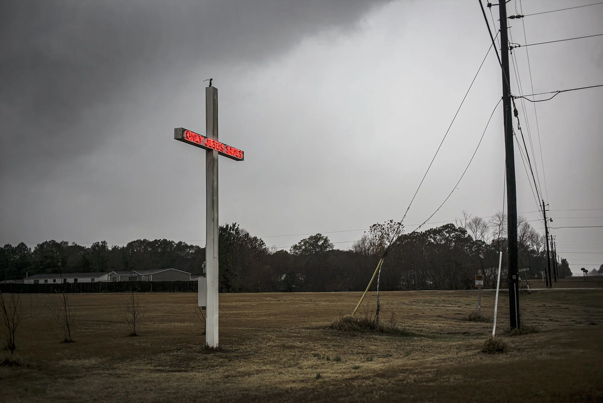 Only Jesus Saves” neon sign along US 80, west of Selma, Alabama. 2014.