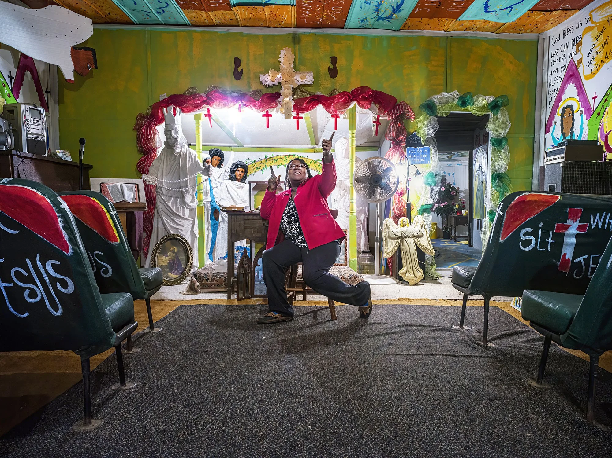 Juanita Leonard at the altar of her church. Montgomery, Louisiana. 2019.