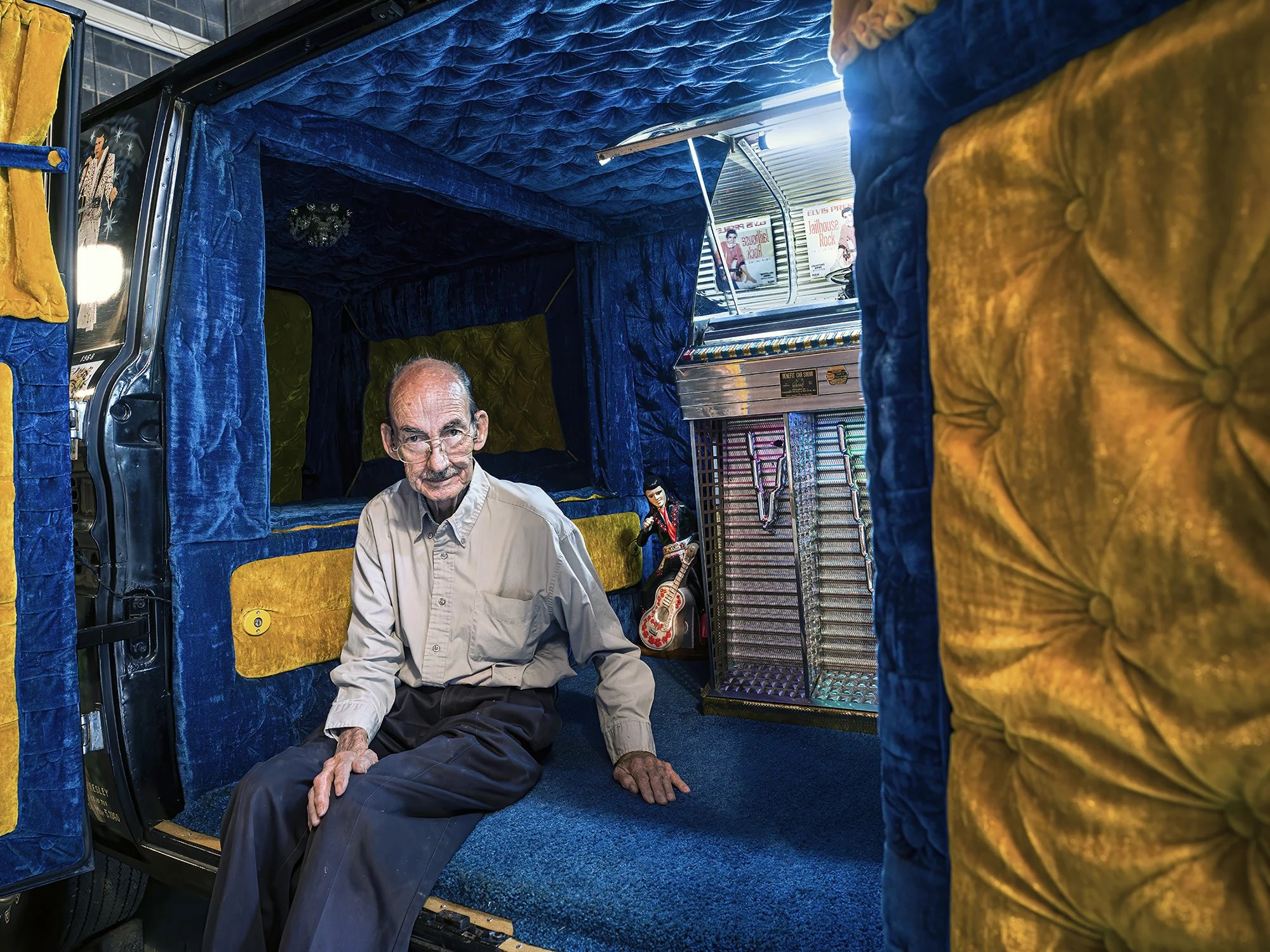 Churchill Winston Hill at the wheel of his Elvis Tribute Van with hand-painted gold discs surrounding buttons to play songs on the jukebox. Elizabethton, Tennessee. 2020.