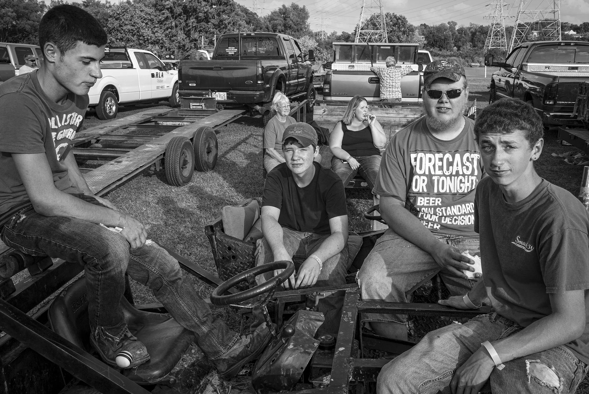 Group of spectators waiting for the Demolition Derby, Carthage Fairgrounds. 2014.