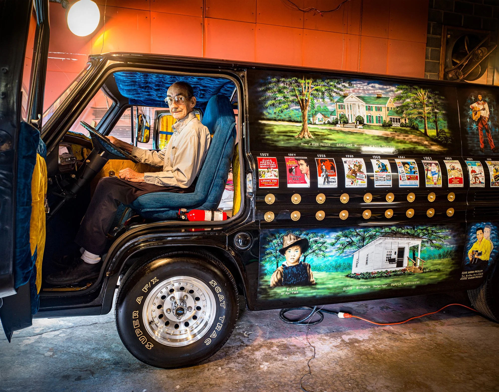 Churchill Winston Hill inside his Elvis Tribute Van with a statue of Elvis and his all-Elvis Seeburg Rockola jukebox. Elizabethton, Tennessee. 2020.