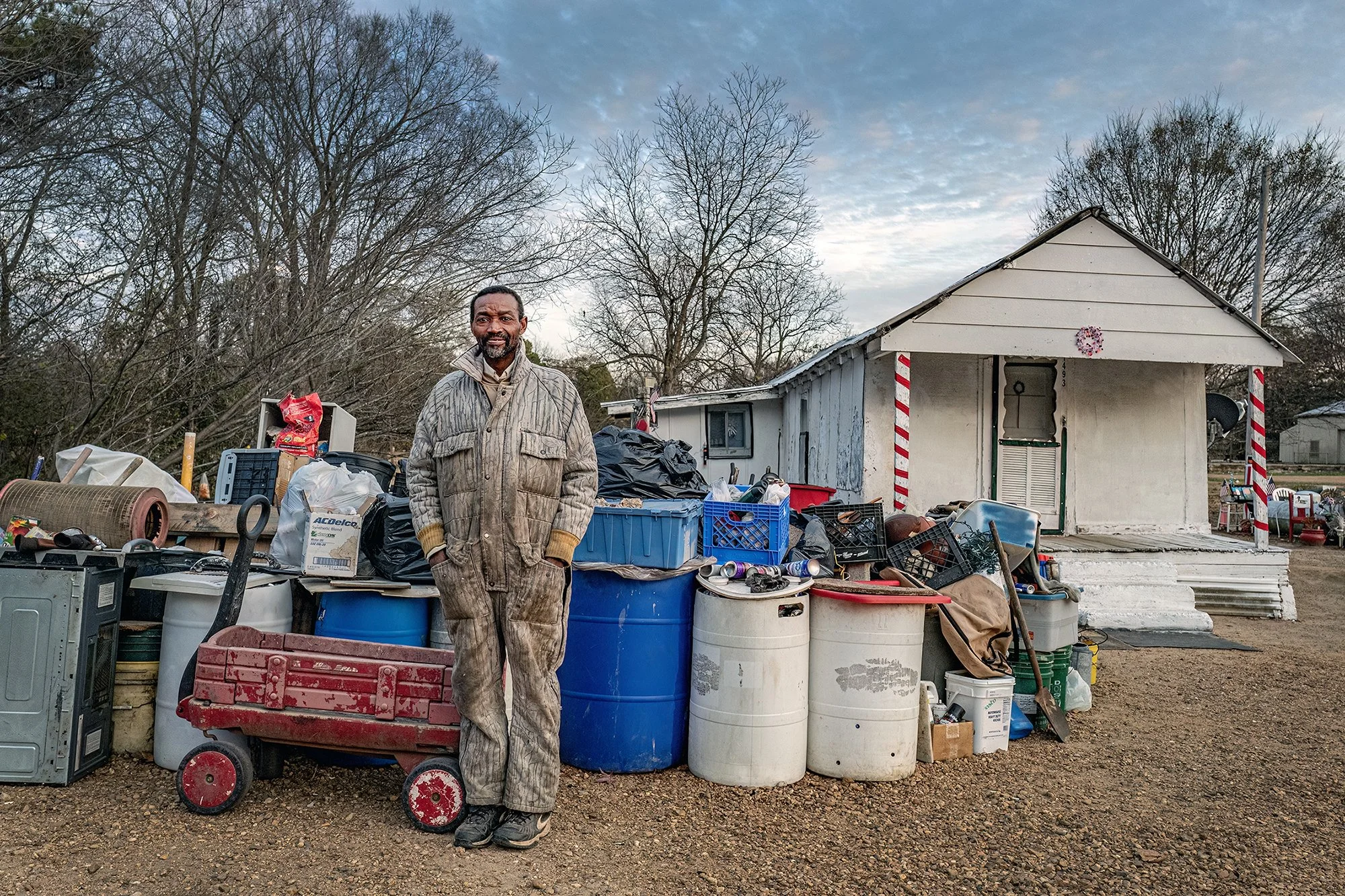 Tim White, recycler, in front of his home. Louise, Mississippi. 2017.