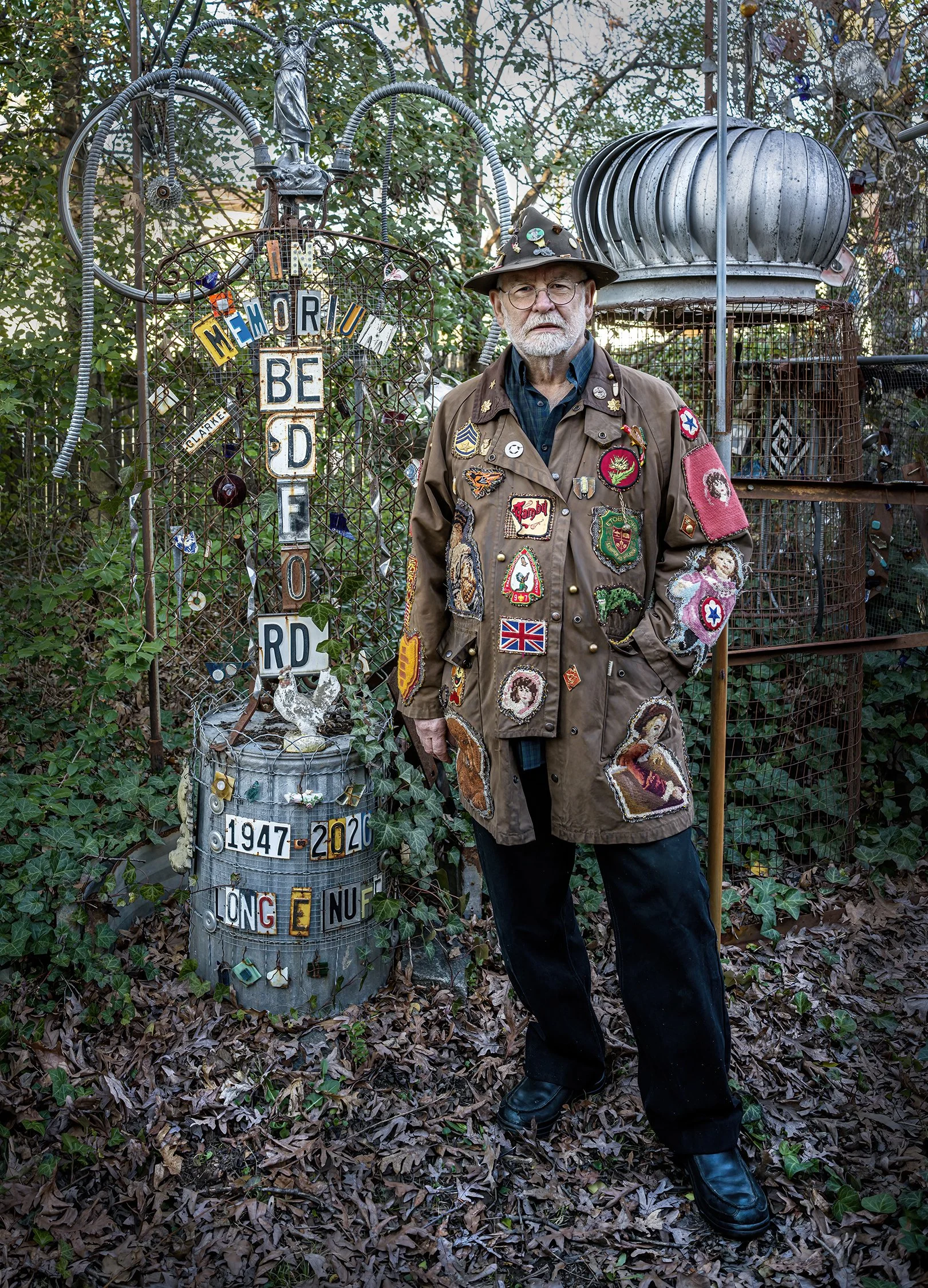 Clarke Bedford in his backyard, next to his proposed grave marker. Hyattsville, Maryland. 2025.