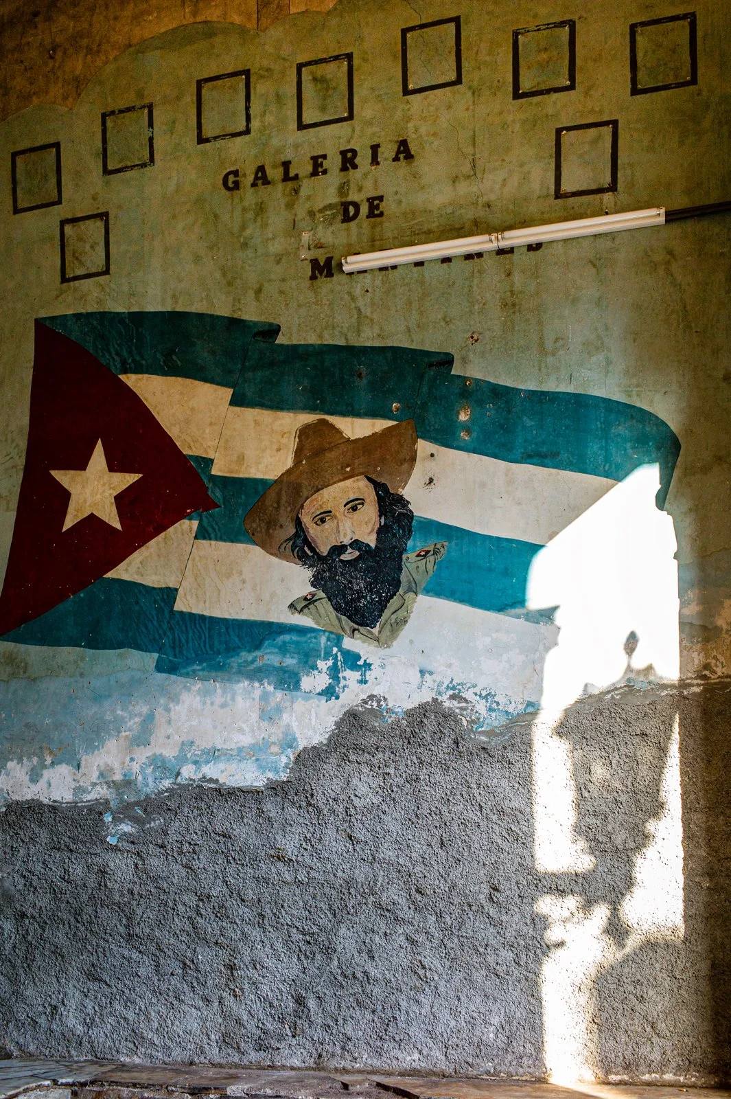 Galeria de Martires (Martyrs), with portrait of Camilo Cienfuegos, LaGuarida building, Concordia Street, Centro, Havana.