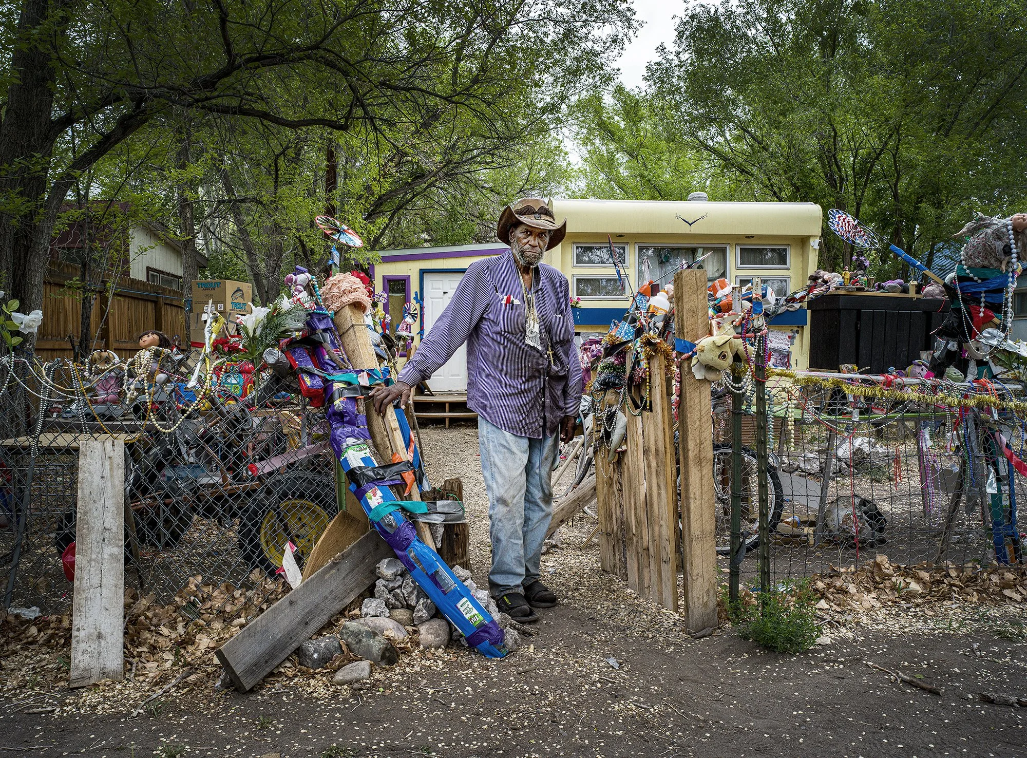 Roy Smith at the gate to home. Saguache, Colorado. 2022.