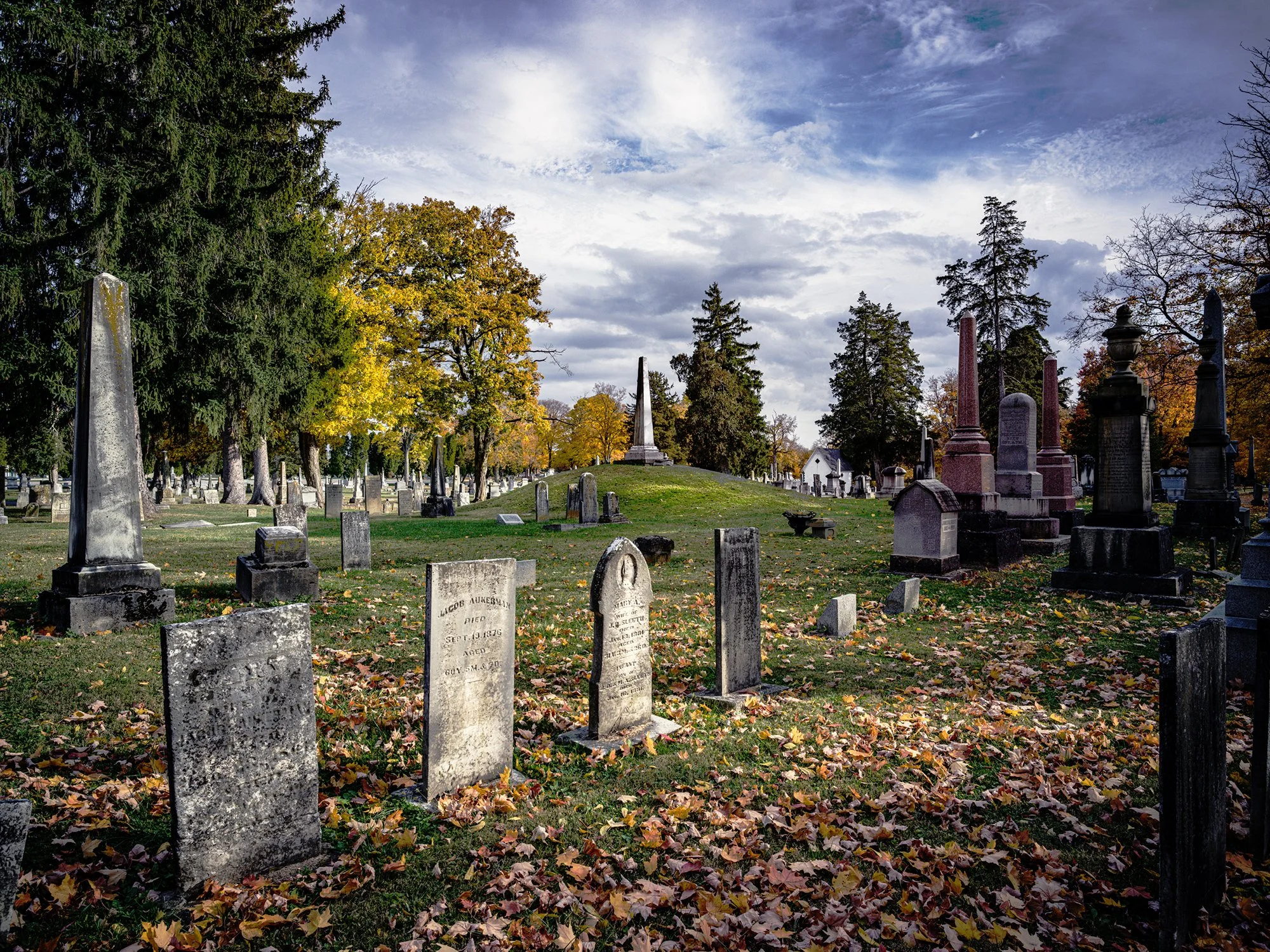 Adena mound topped with a stone obelisk monument to American soldiers killed in battle with Miami warriors. Eaton, Ohio. 2023.