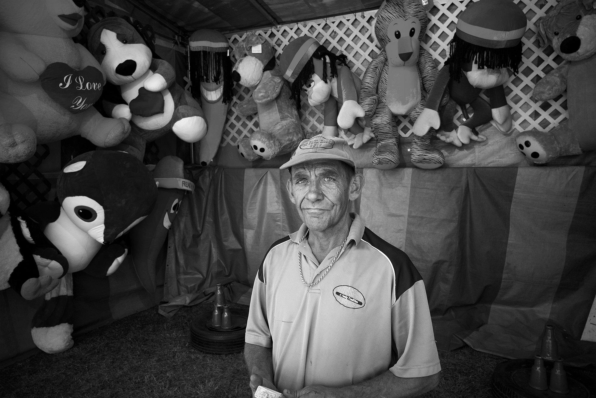 Game sideshow barker at the St. Paul Rodeo. St. Paul, Oregon. 2013.