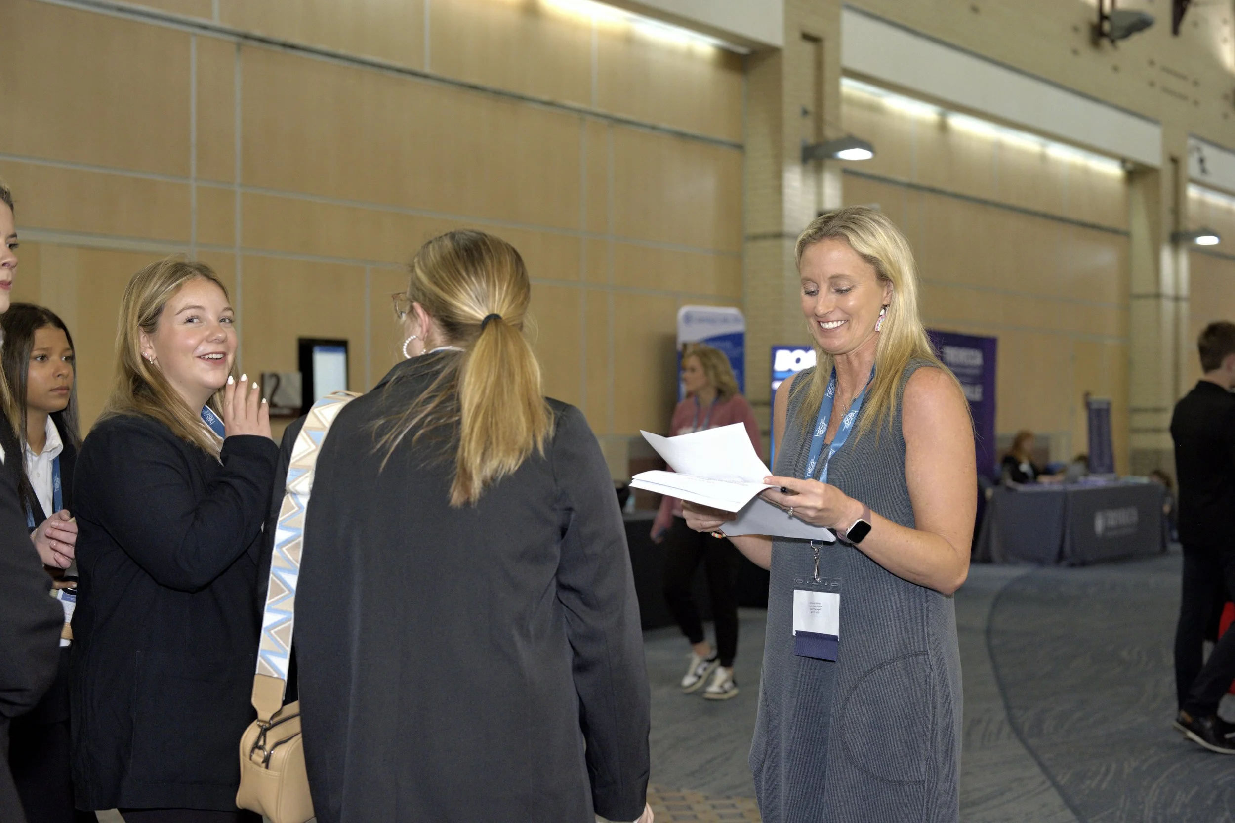 A HOSA advisor talks to her students at the State Leadership Conference.