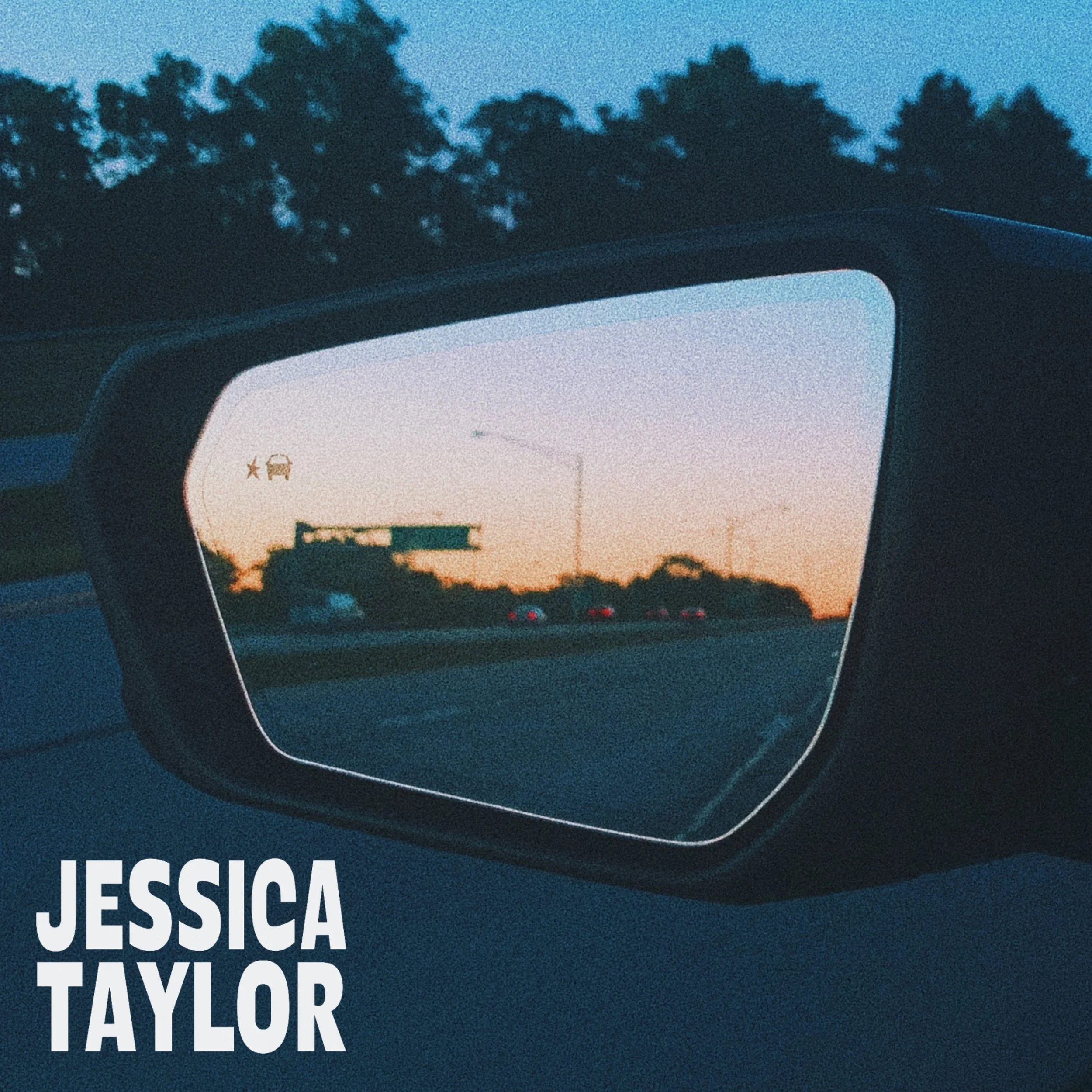 A view through a car side mirror showing a sunset with trees and a highway, with the text 'JESSICA TAYLOR' in the bottom left corner.