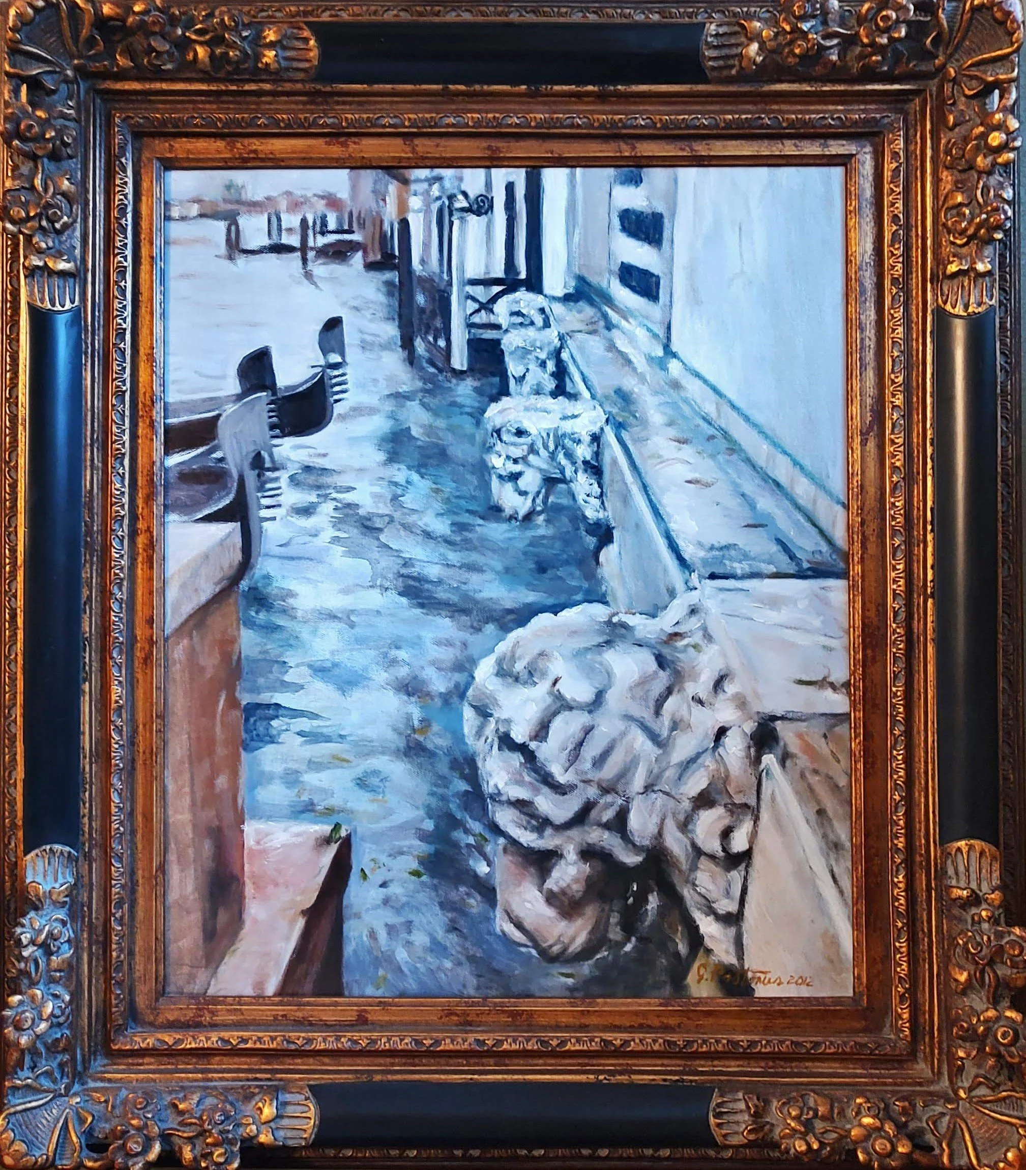 A painting of a canal scene with stone lion sculptures in the foreground, outdoor café tables and chairs on the left, and a building with striped awnings on the right, framed with ornate wood.