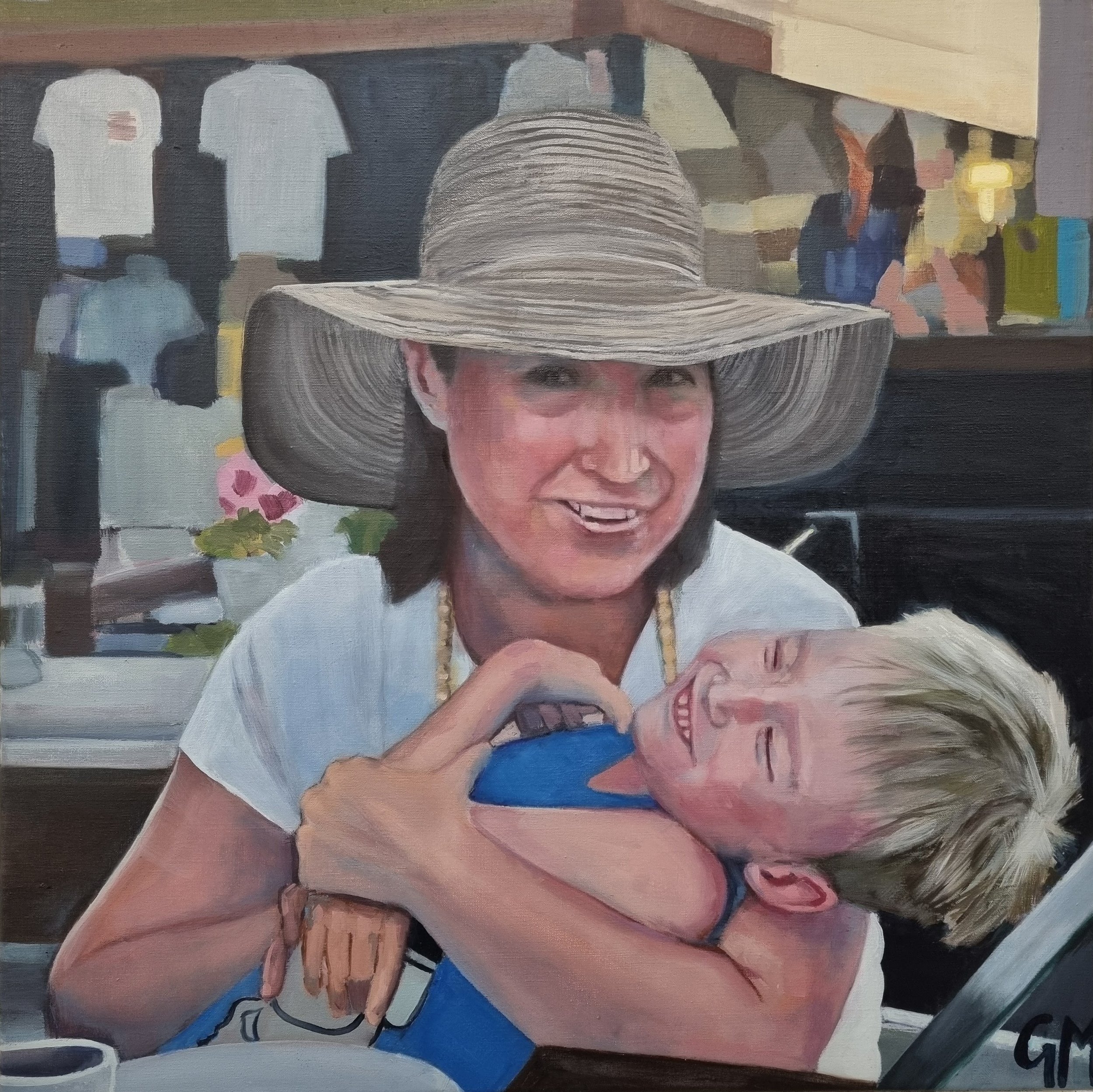 Oil portrait of Gisela smiling, wearing a hat and holding her son Callum in her arms