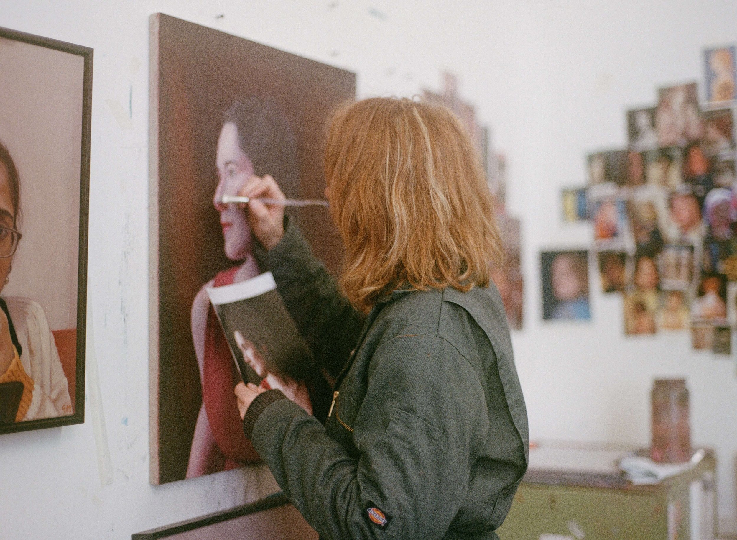 Genevieve working on an oil portrait in her studio