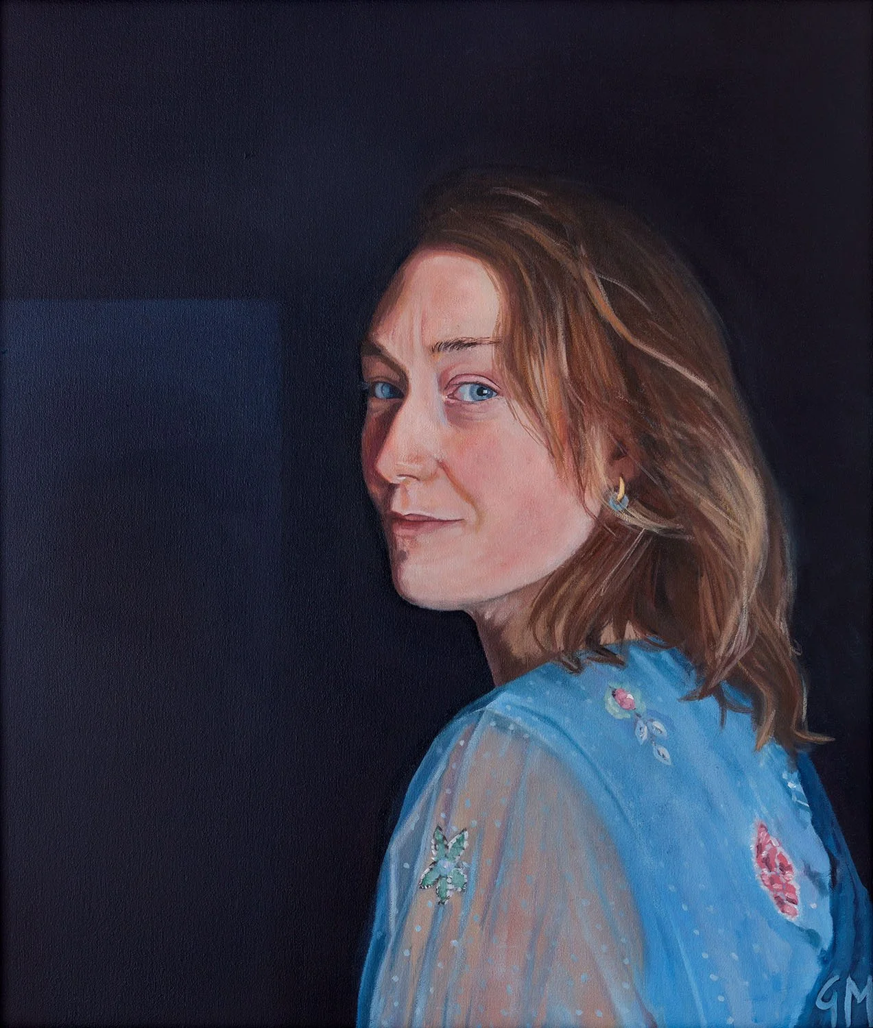 Oil portrait of Emily, looking over her shoulder at the viewer. The background is a deep blue background and she is wearing a light blue dress.