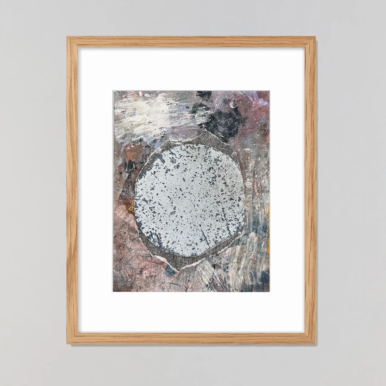 Framed mixed media collage from the Urban Sediments series, featuring layered, torn, abraded, and stained photographic fragments of urban textures arranged into an abstract composition that evokes weathered city surfaces.