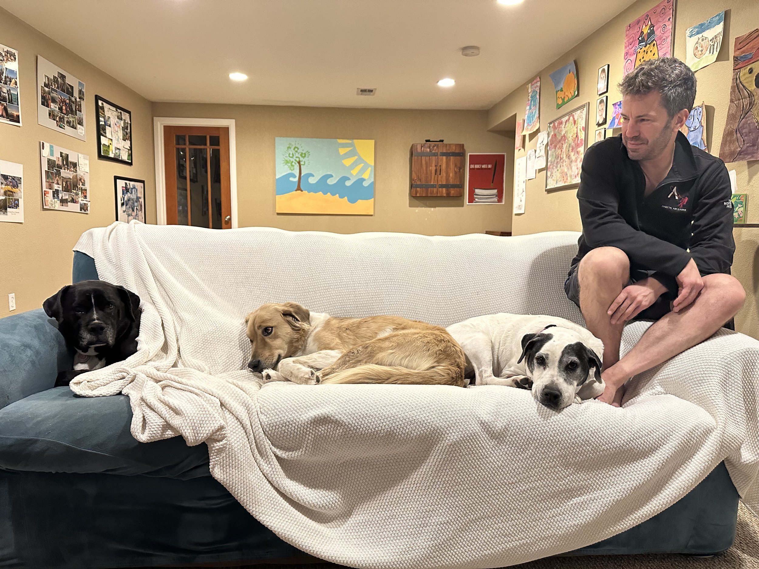 Jesse with the mutt cluster... Pluto, Pecos, and Luna