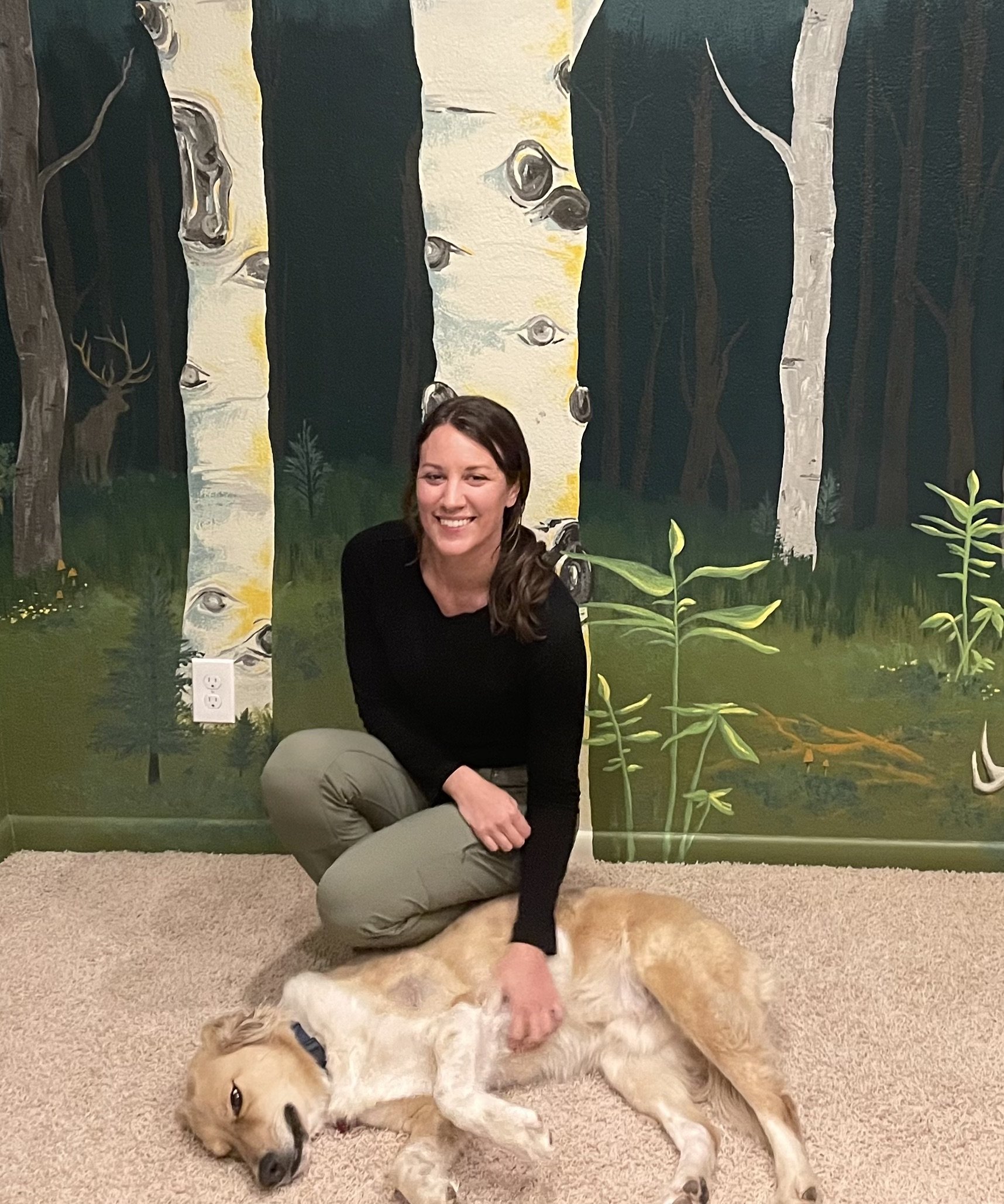 Pecos resting in front of our first mural!