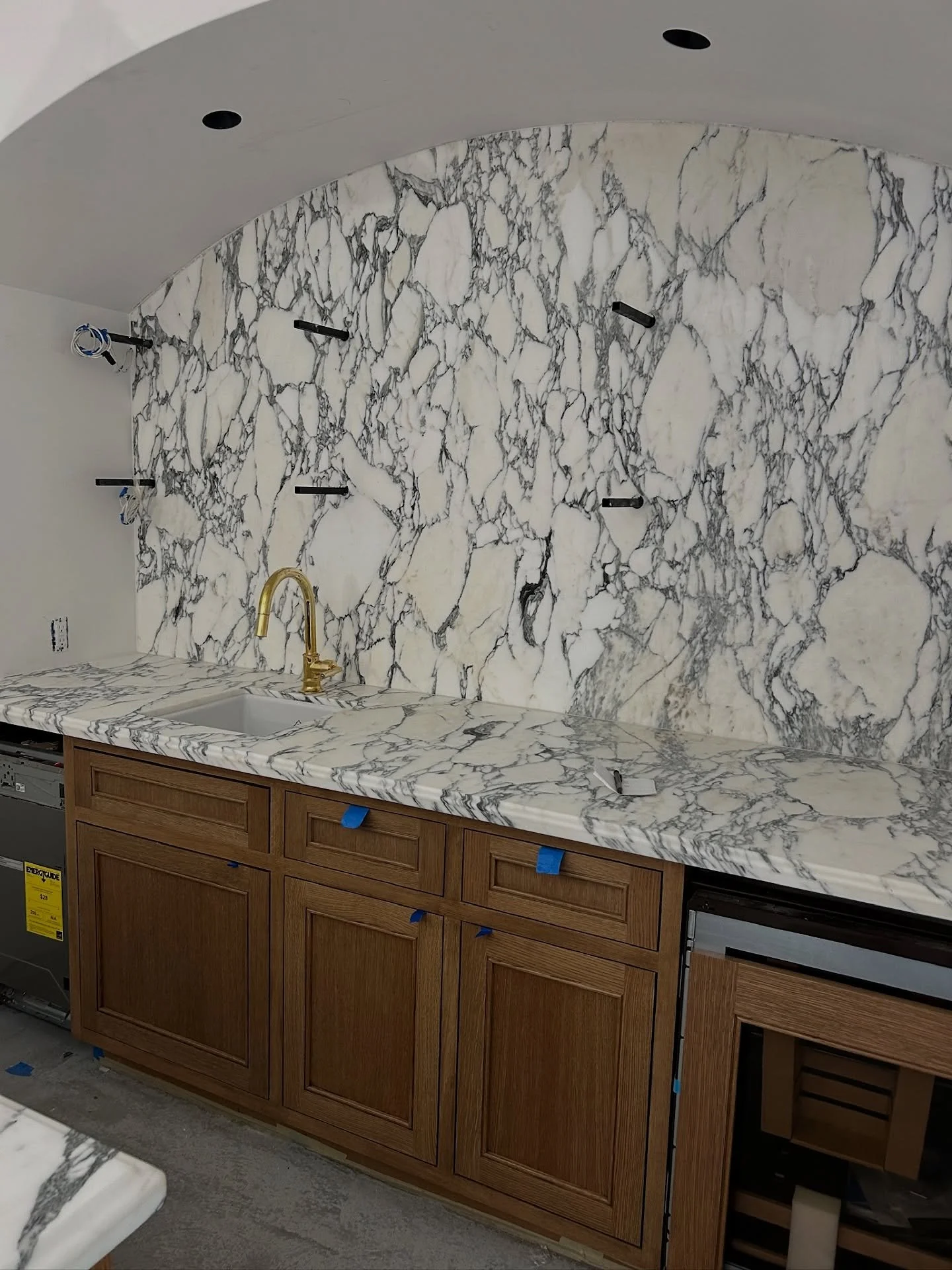 📍Party Pad | Finishes in Full Swing
We&rsquo;re on to the fun stuff at the Party Pad&mdash;and this one&rsquo;s already full of texture, tone, and serious transformation.
🔹 Warm Woods + Statement Stone: Beautiful rift white oak cabinetry is going i