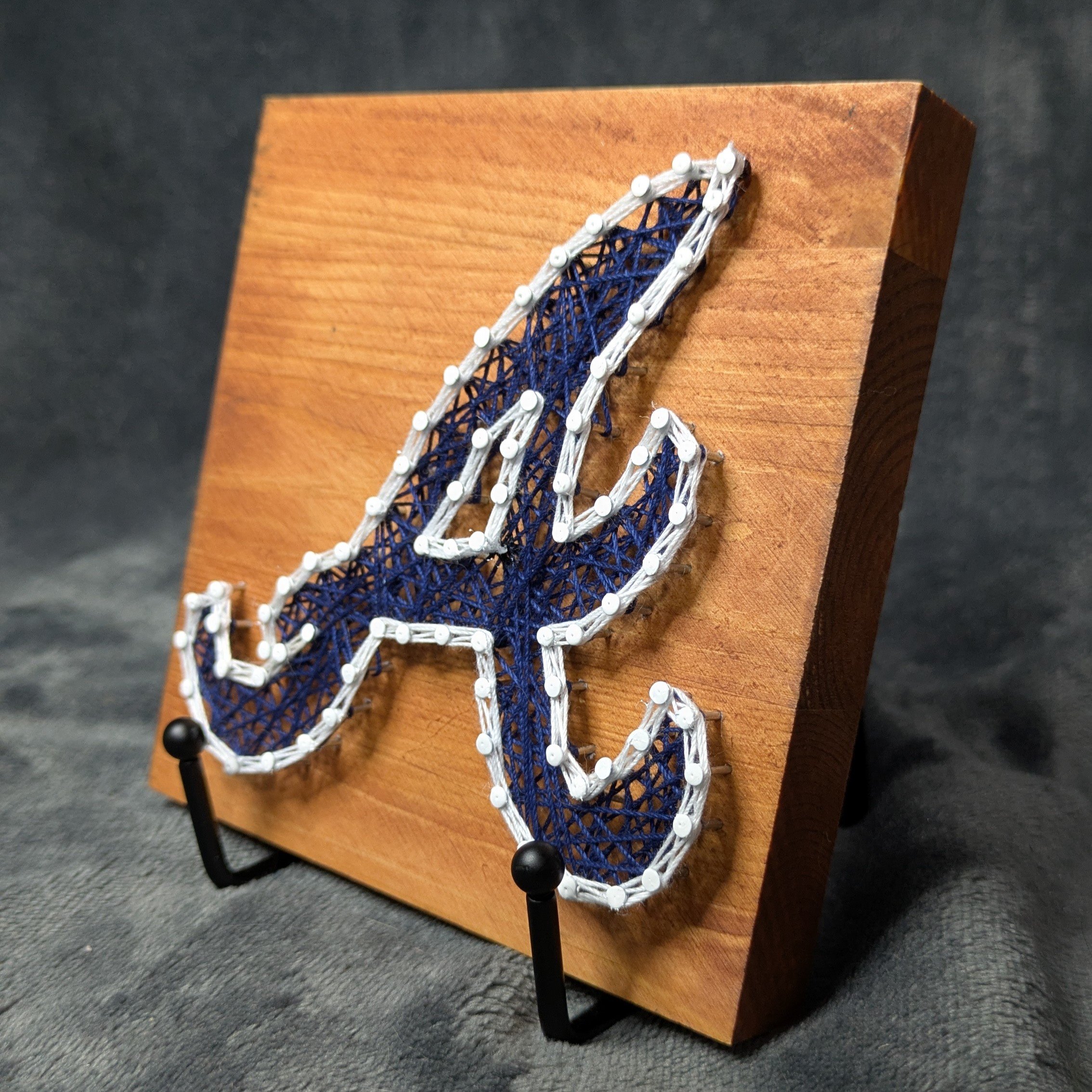 Atlanta Braves Logo Blue with White Border on a Light Board