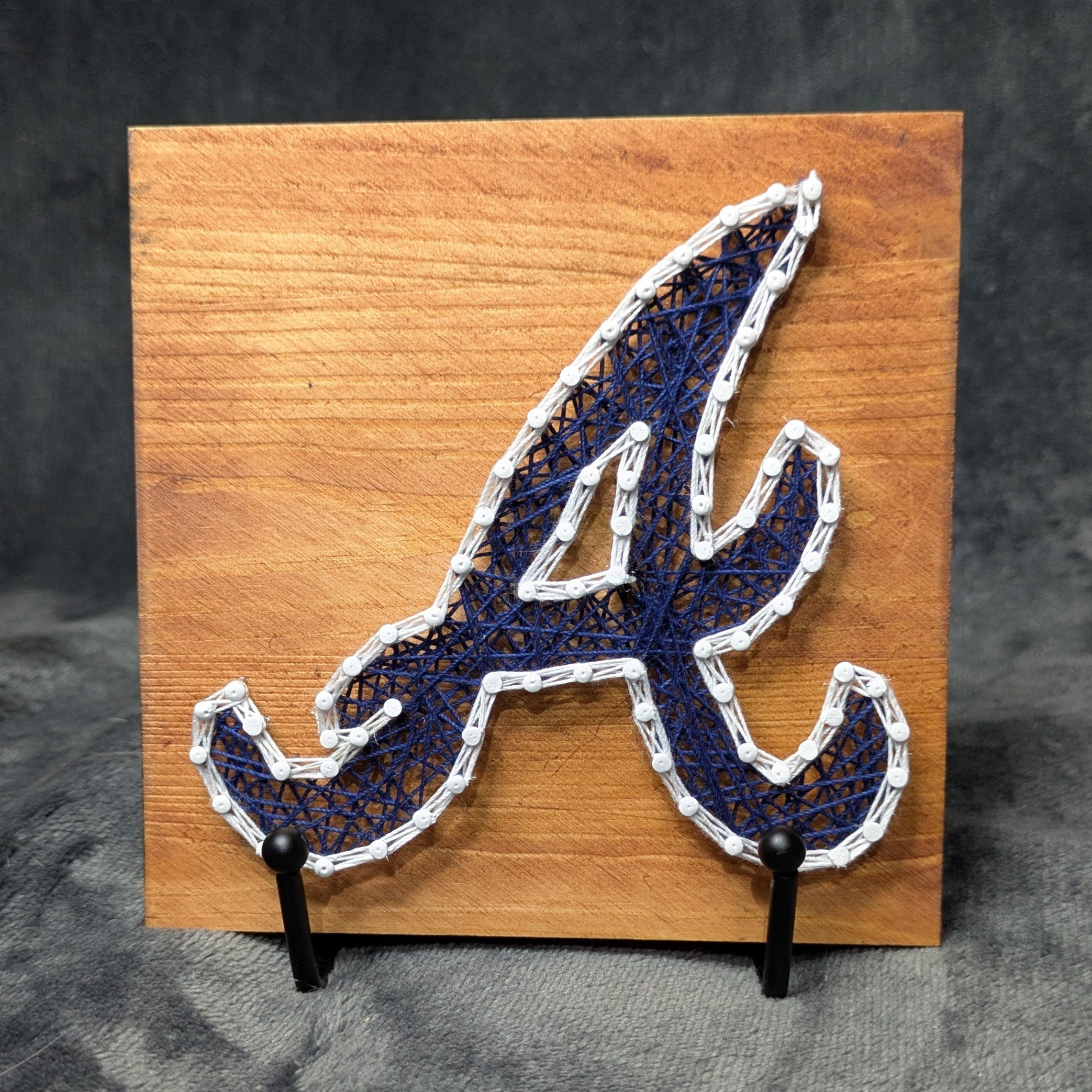 Atlanta Braves Logo Blue with White Border on a Light Board
