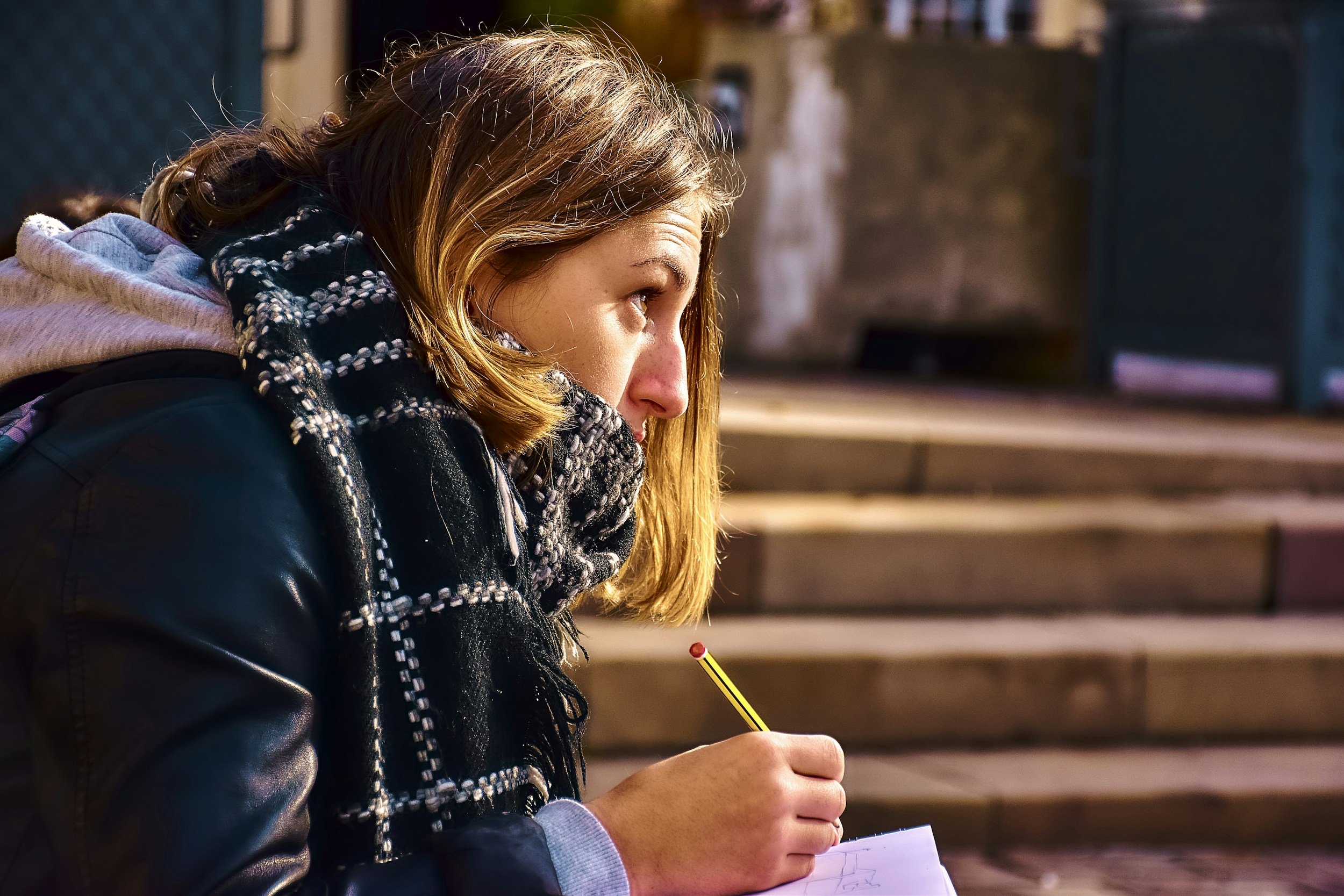Person journaling to process emotions representing cognitive behavioral therapy and emotional processing
