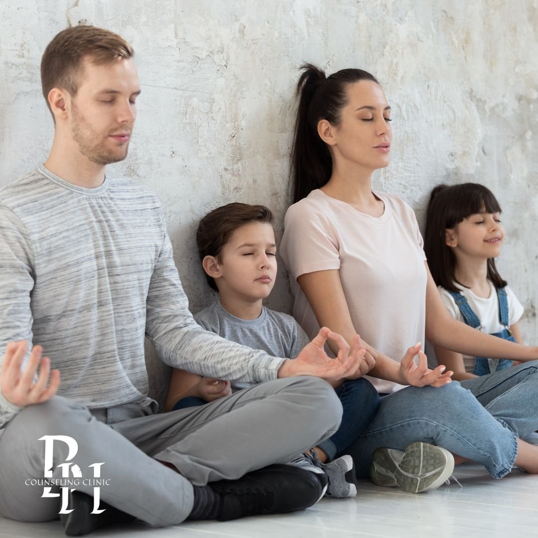Parent and child practicing calming breathing exercise together at home