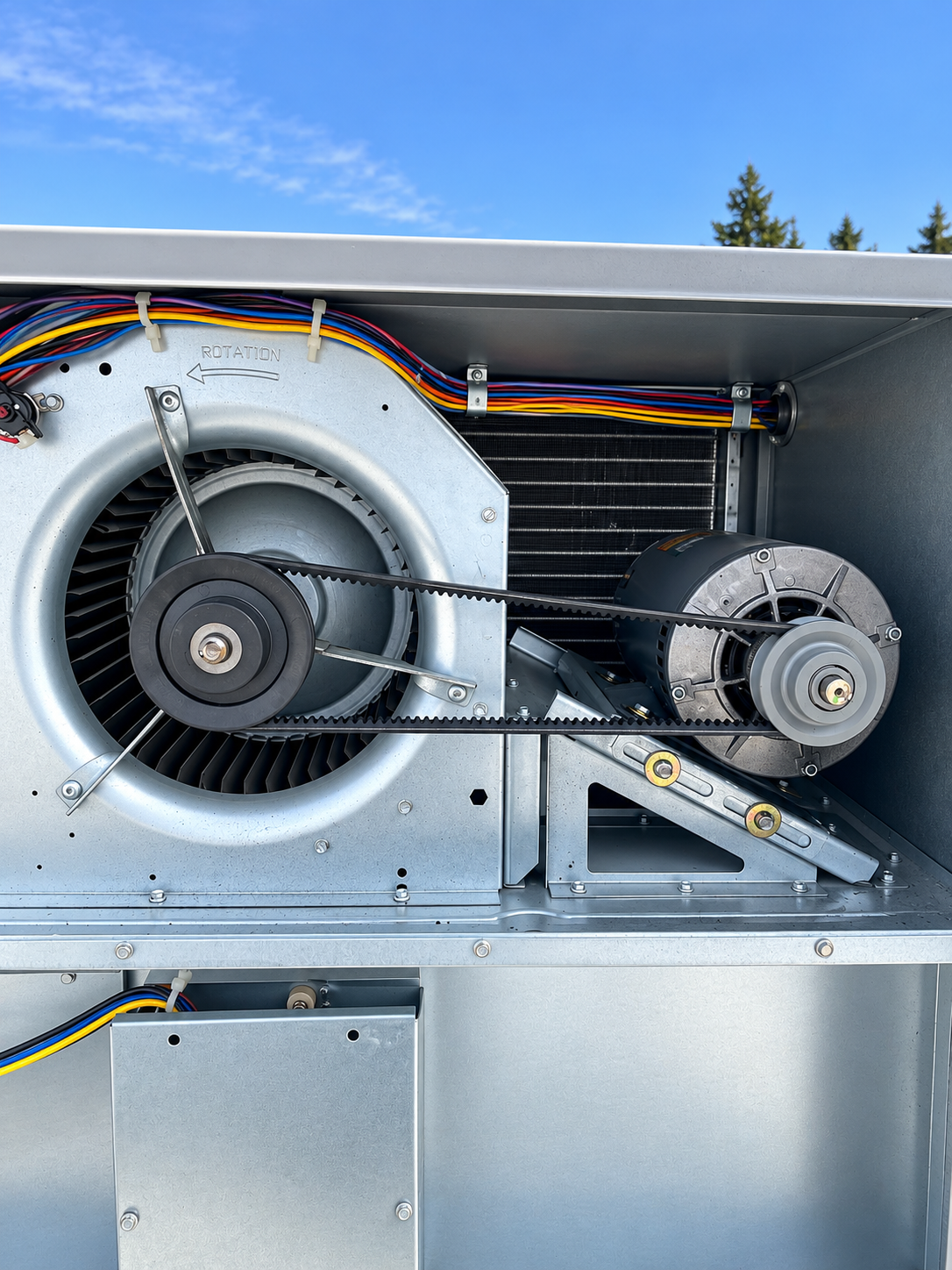 Rooftop package HVAC unit blower motor and belt serviced at a Federal Way restaurant