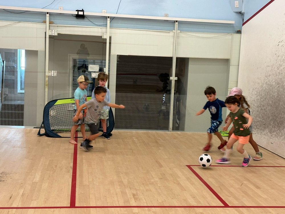 Children playing games on the club court