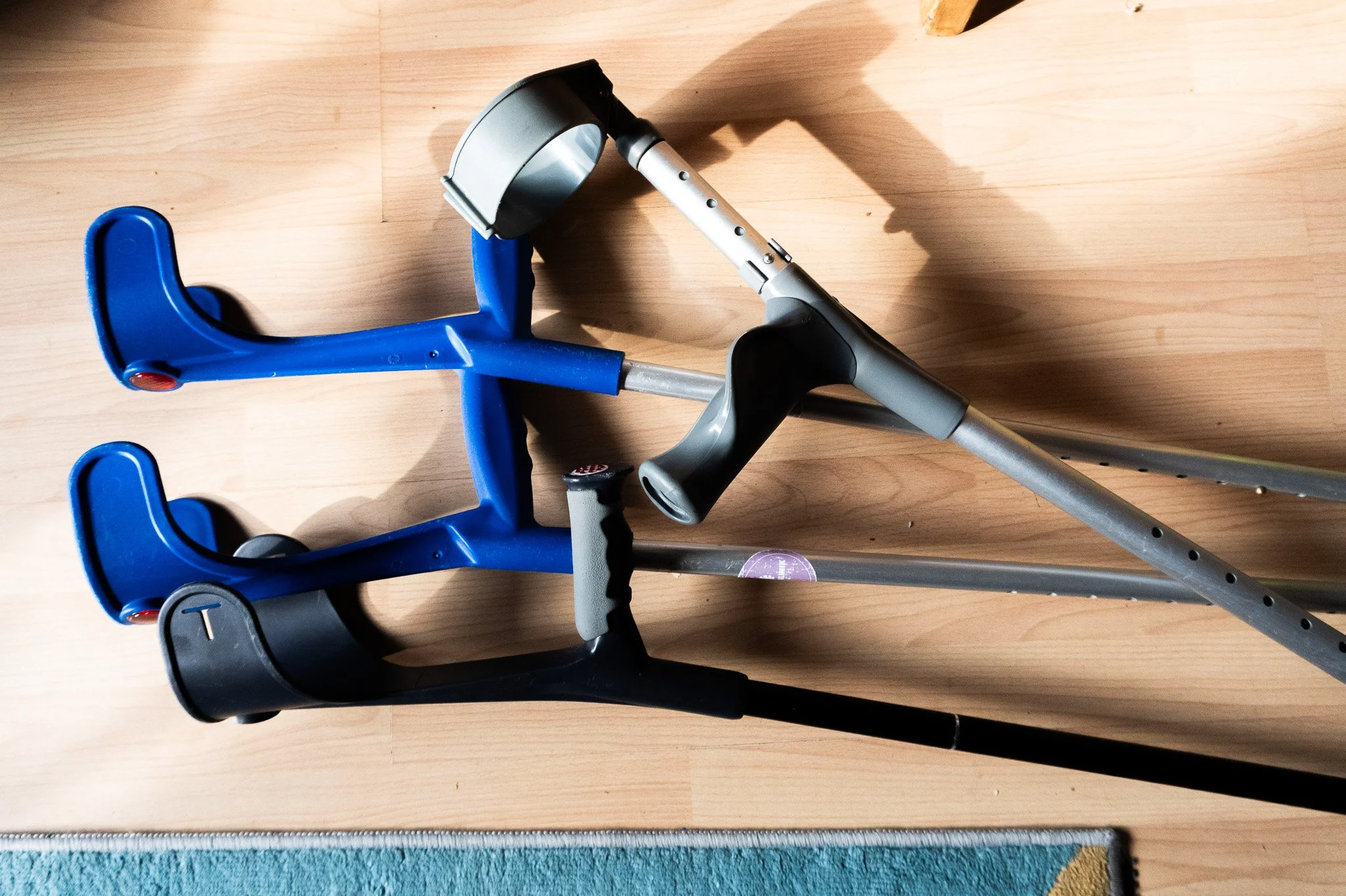 Four of Jack’s crutches laying on a floor