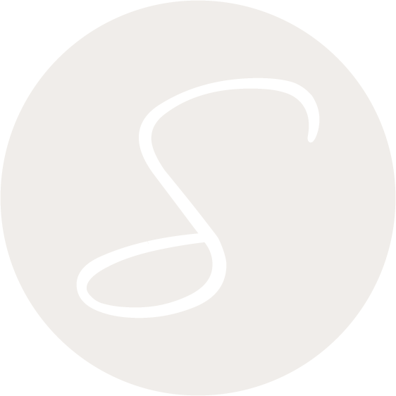 Black cursive letter 'S' on a light gray circular background.