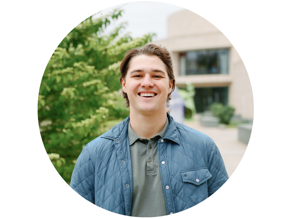 Man in a gray button-down smiling