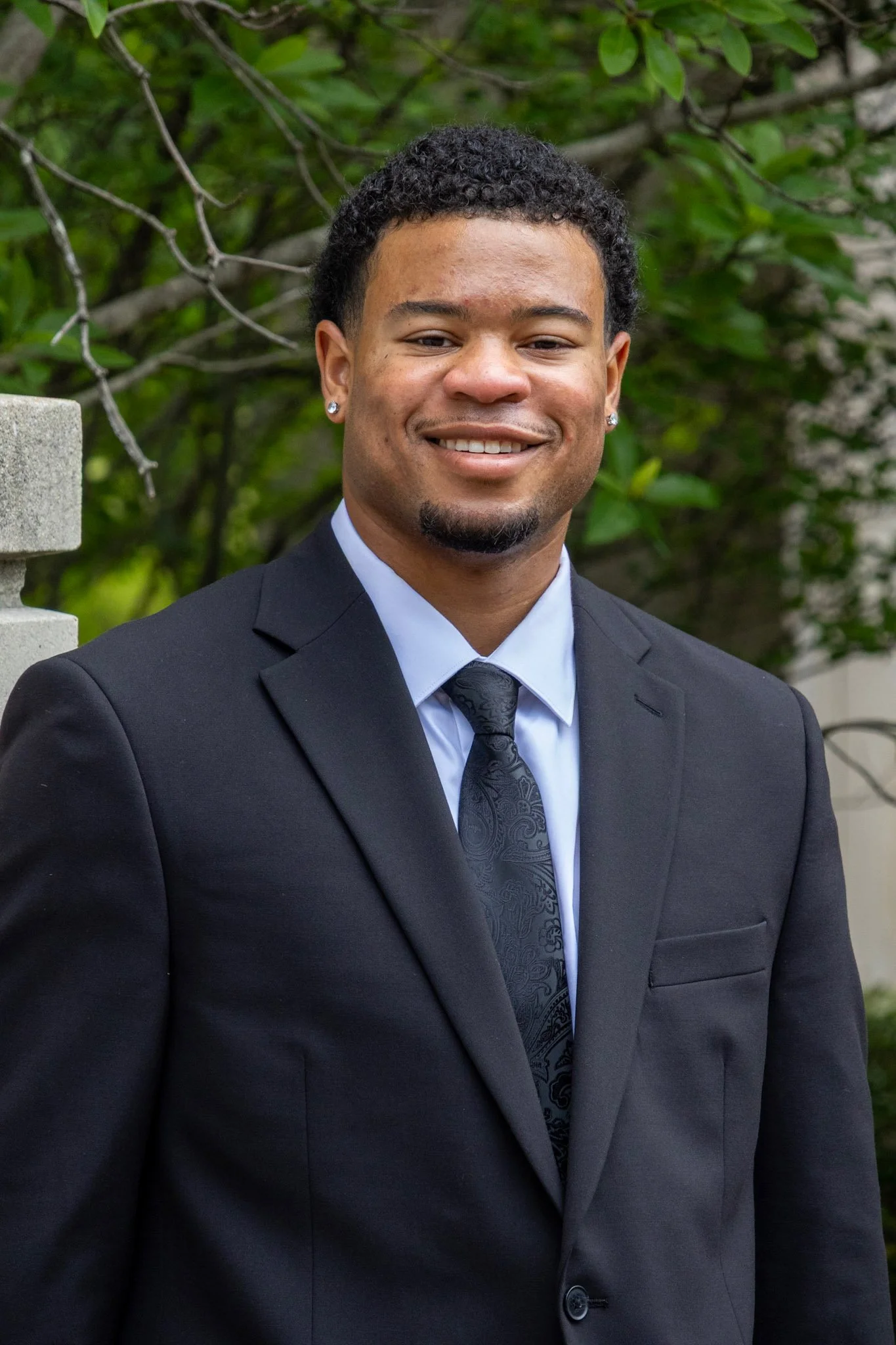 Smiling person in a suit