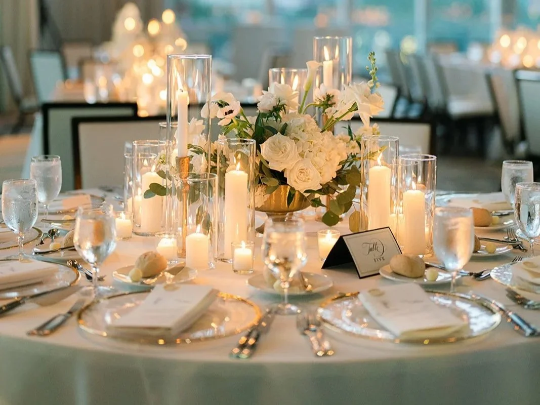 Emerald Gardenia close-up floral tablescape detail with candles and refined styling.