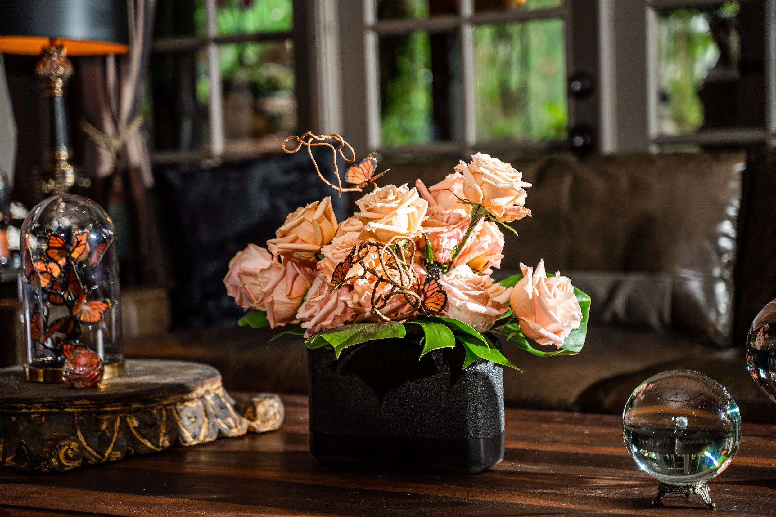 Emerald Gardenia roses arranged on table for refined celebration styling.