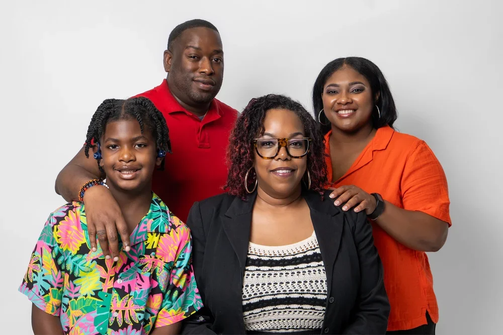 Owner Candance Taylor with a youth and two cast members from the first stage play.