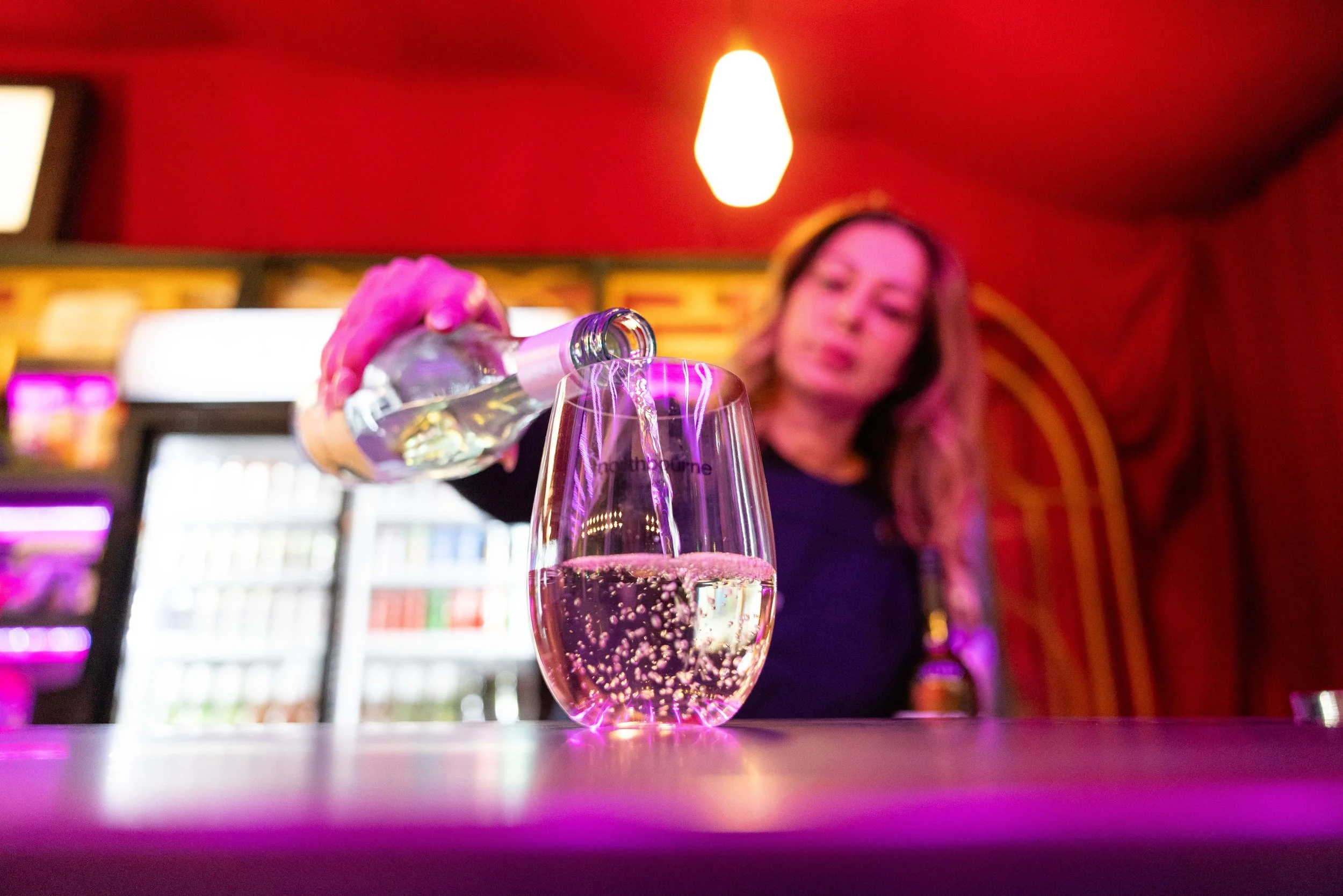 Bar staff pouring wine into a Northbourne glass.