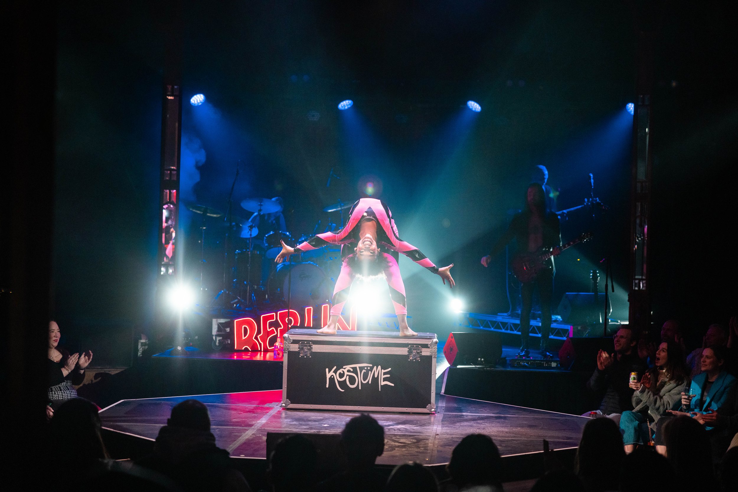 Caberet person doing a backwards bend on stage