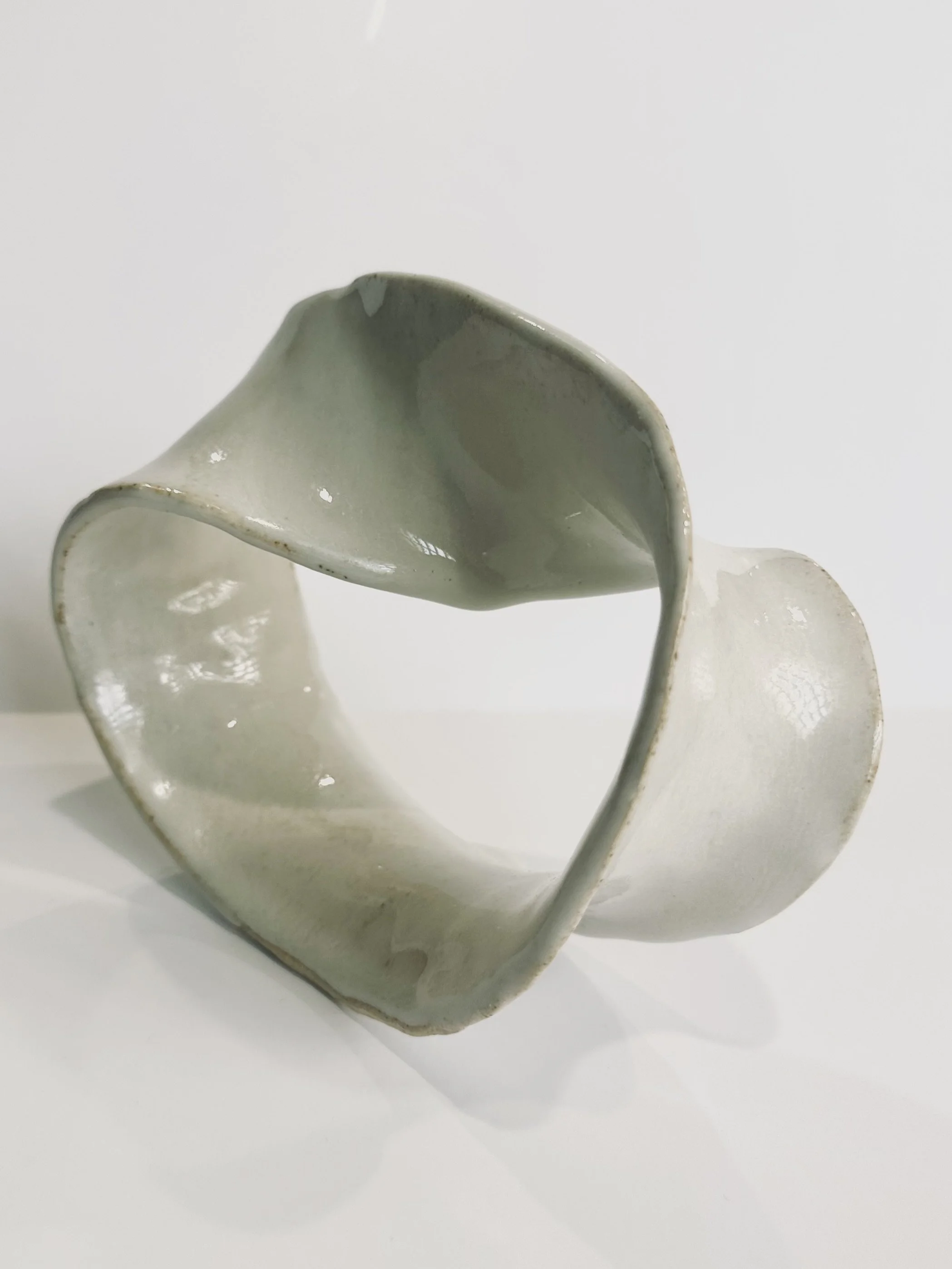 Curved Möbius Strip in Cream