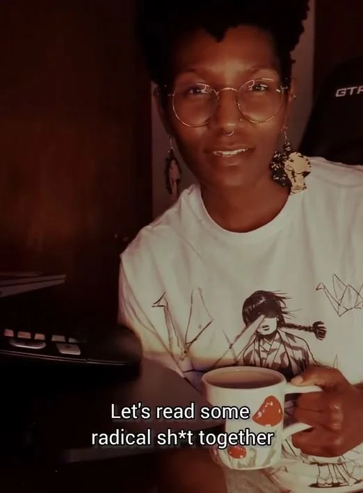 Kenyatta lookin into the camera. The text below them reads "Let's read some radical sh*t together."