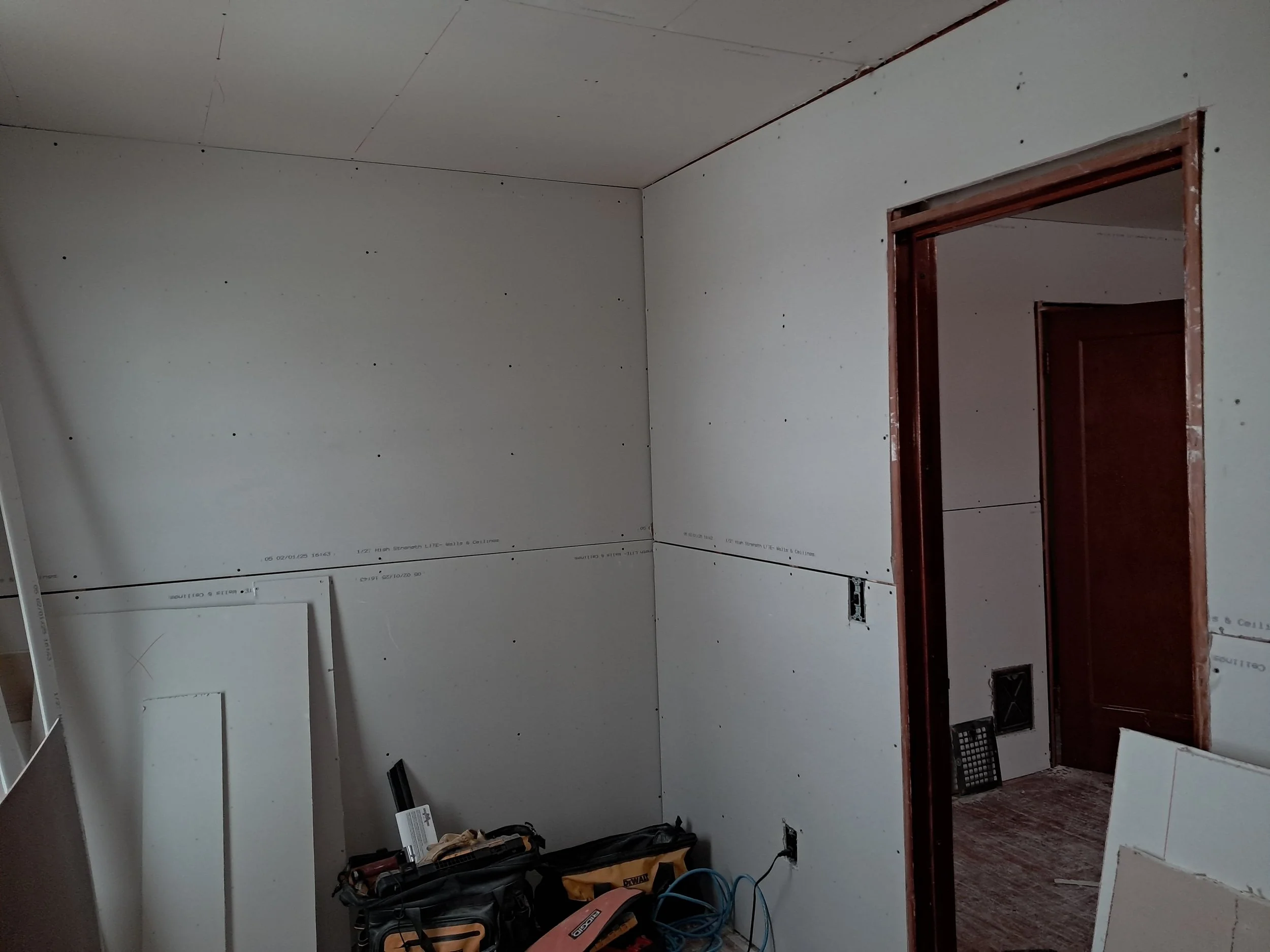Room getting drywall installed