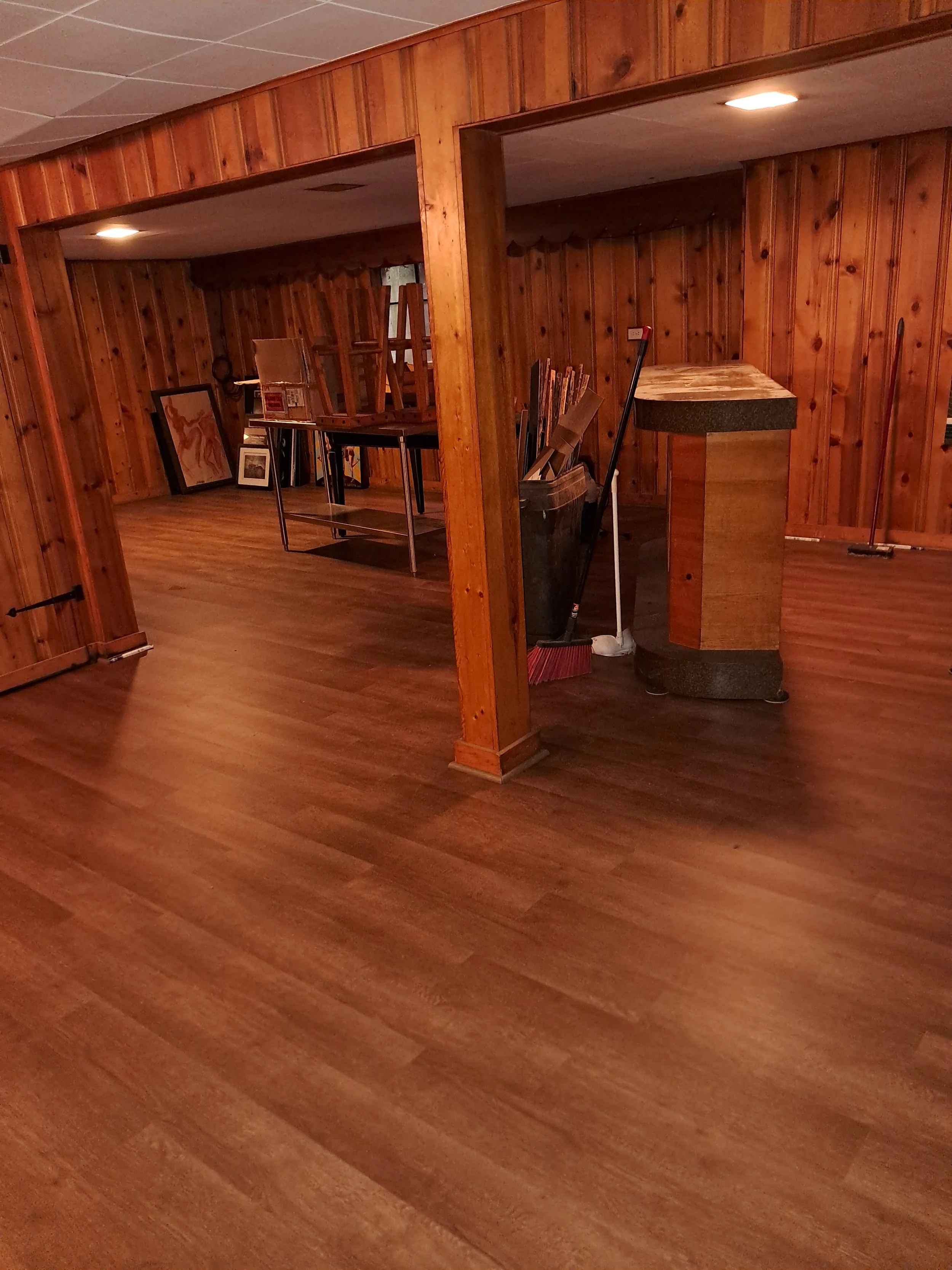 Basement finished with cedar walls and vinyal plank floor instilation.