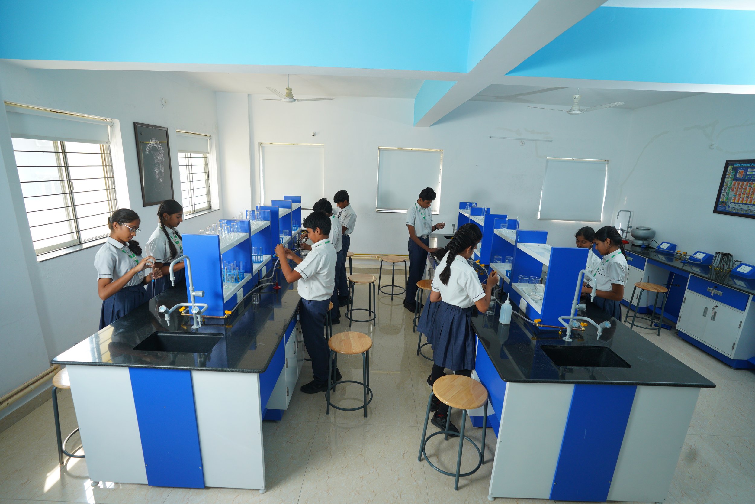 Students in a school science lab conducting experiments.