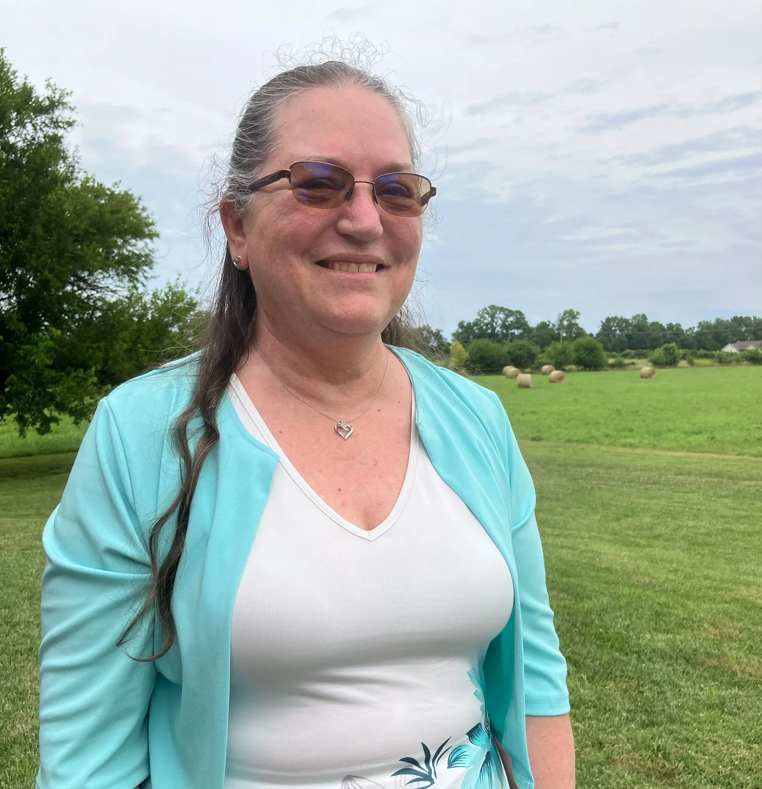 An older woman in a dress.