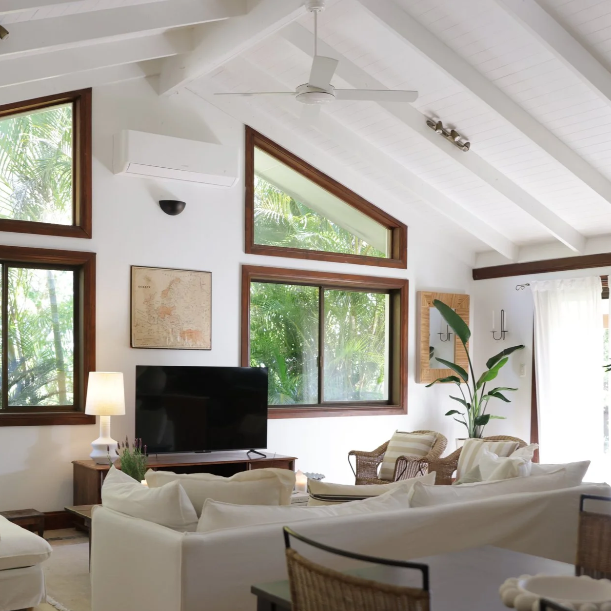 Living room styled by Sabrina Talo Studios in Bangalow featuring neutral tones, timber furniture and curated décor.